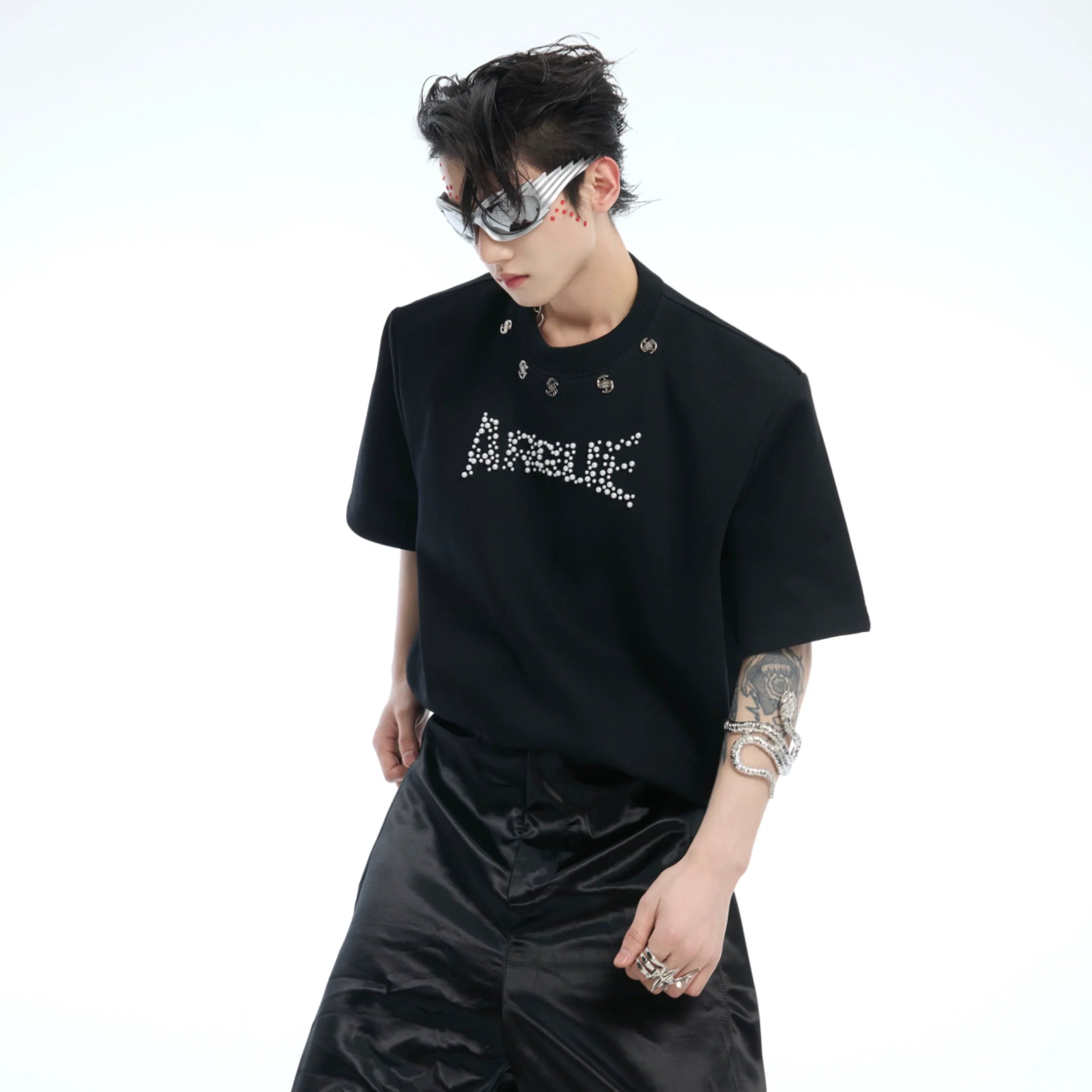 Oversized drop-shoulder tee featuring pearl bead embroidery logo, perfect for urban streetwear style