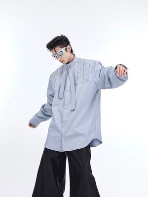 Fashion model wearing deconstructed pleated shirt showing the relaxed streetwear silhouette