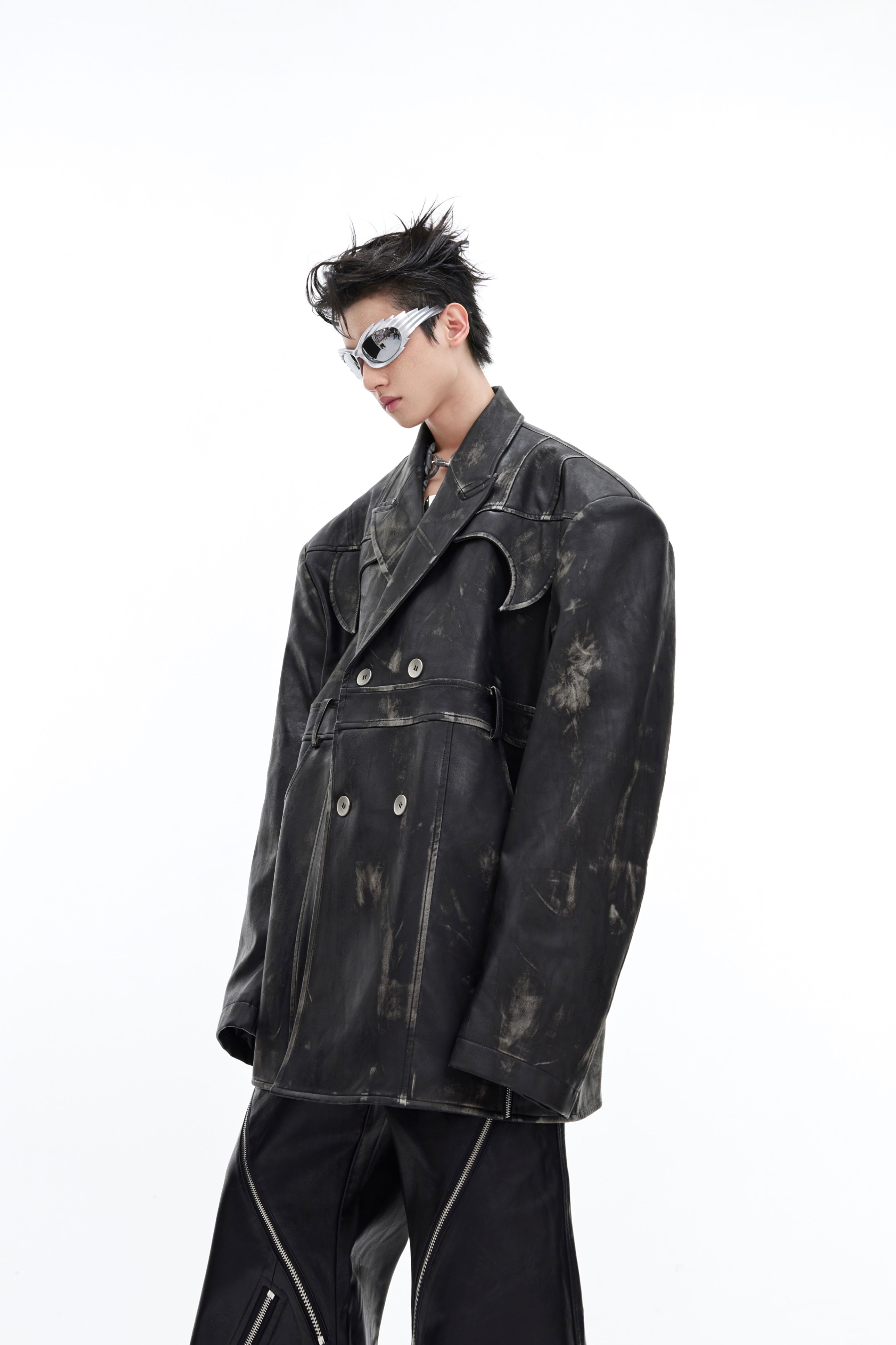 Detail shot highlighting the exaggerated shoulder design and heavy-duty leather construction