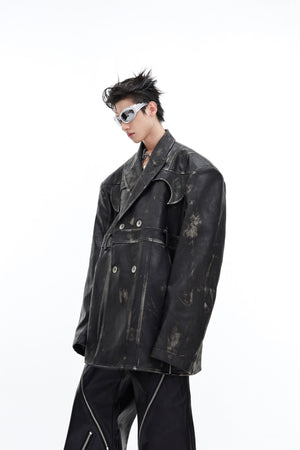 Detail shot highlighting the exaggerated shoulder design and heavy-duty leather construction