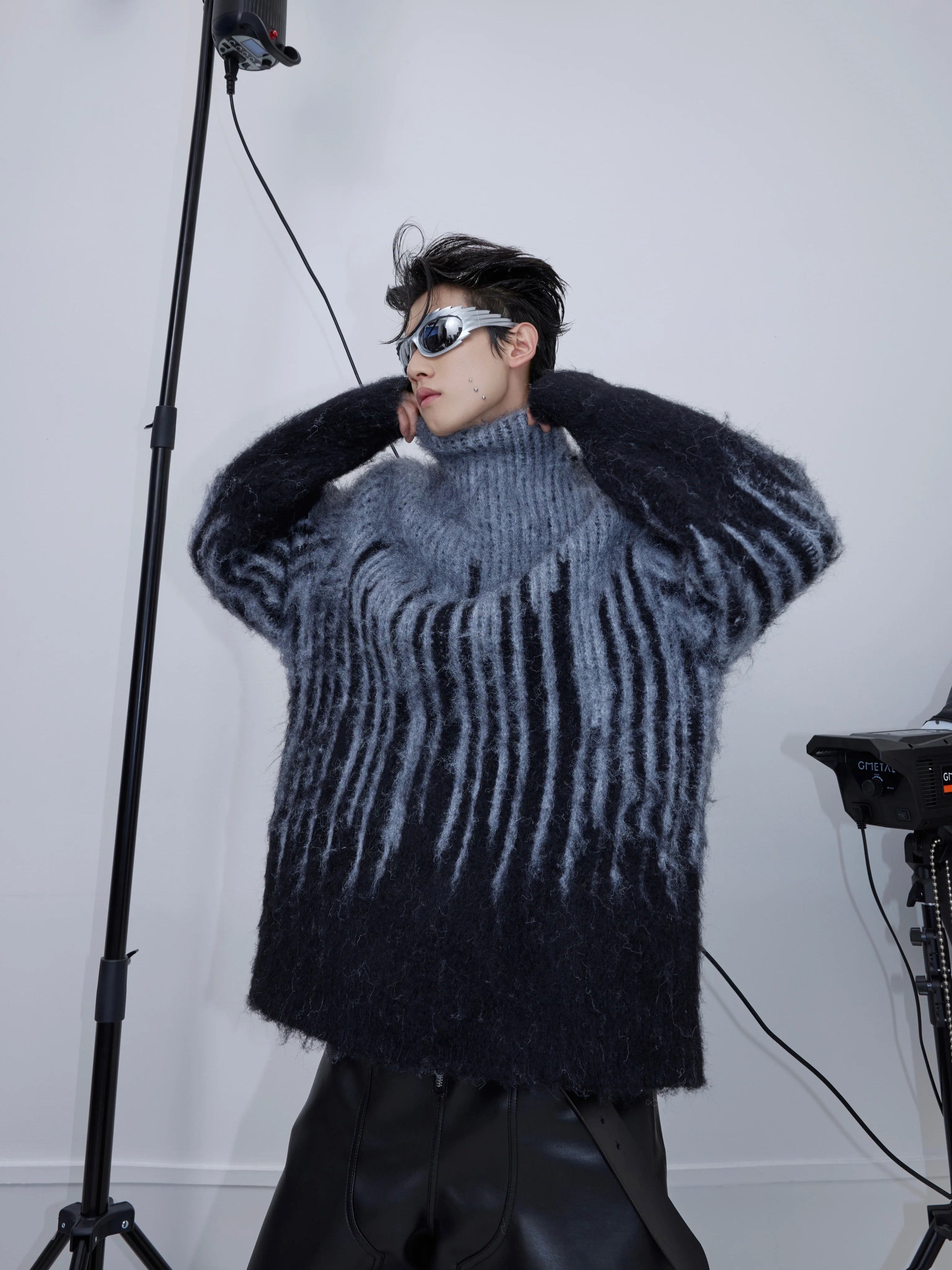 Front view of oversized mohair sweater with bold colorblock stripes and high neck design for stylish winter wear