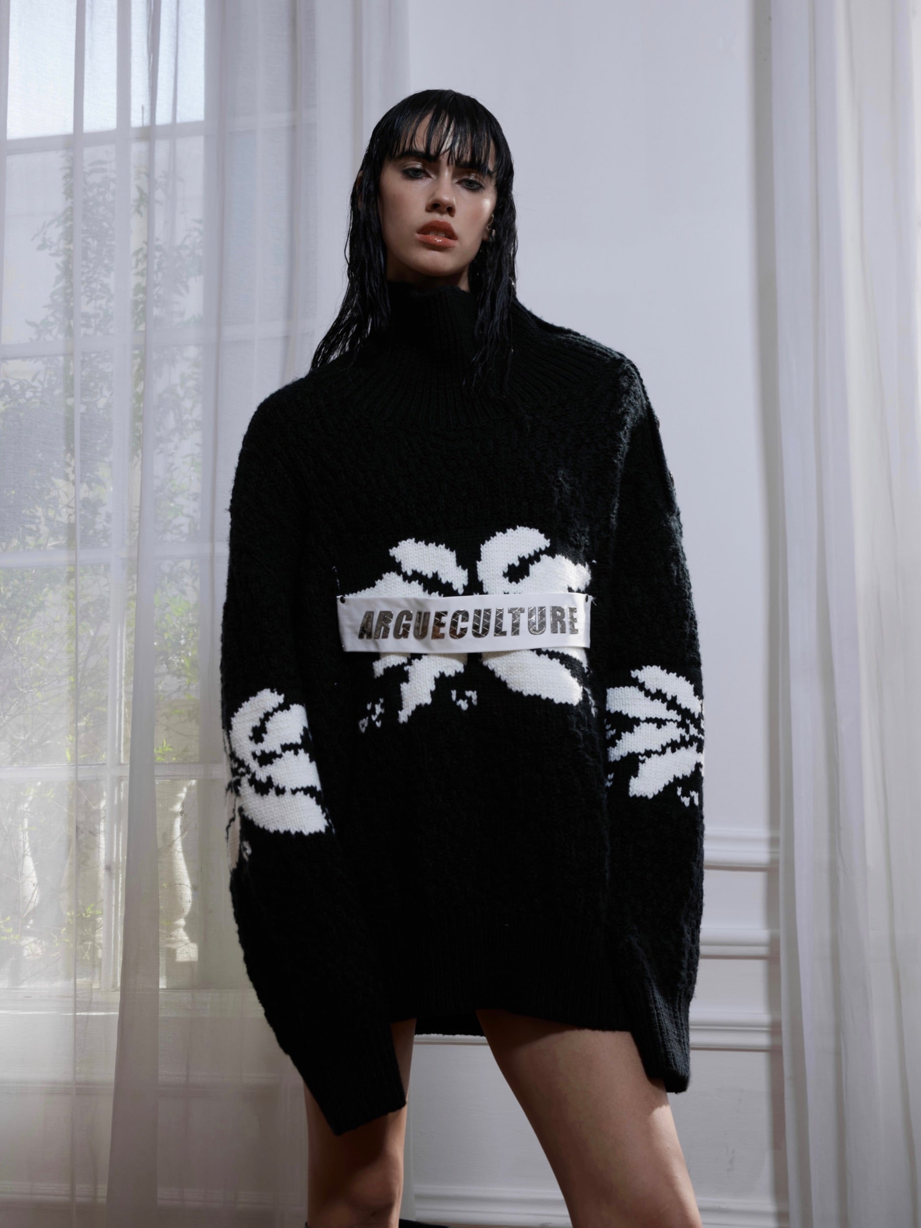 Close-up of the premium high neck collar with chunky knit texture on this oversized streetwear sweater