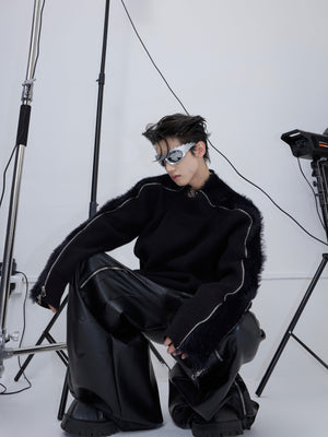 Side view of deconstructed sweater demonstrating two-way zipper functionality for adjustable styling