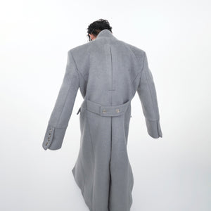 Back view of warm winter wool coat featuring clean lines and urban street style