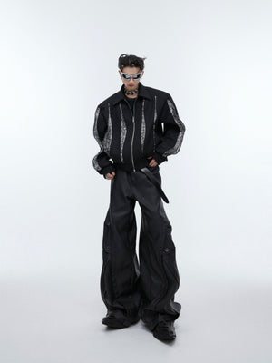 Luxurious black patchwork jacket with deconstructed design elements and premium construction