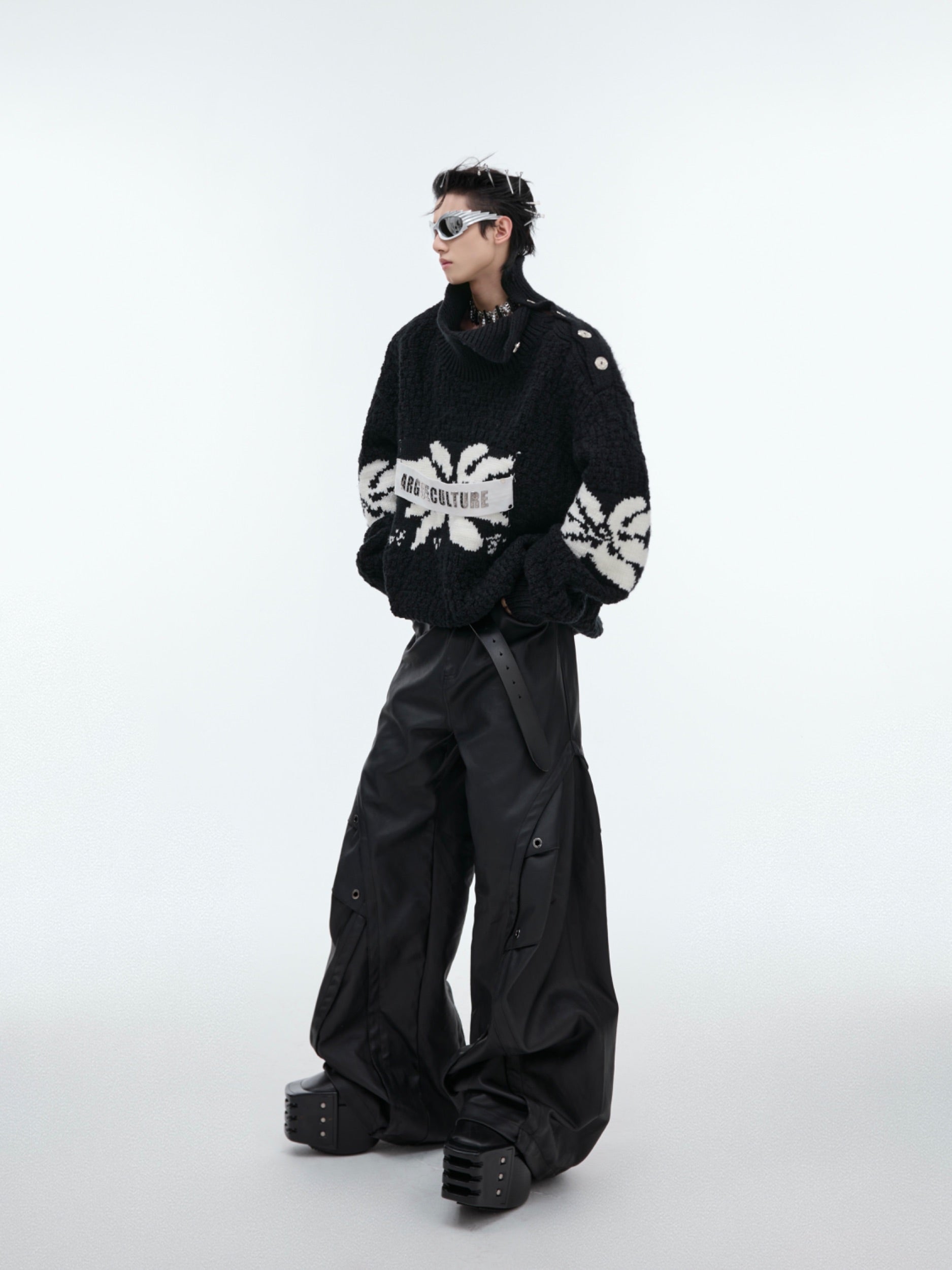 Back view of deconstructed vintage patchwork sweater showing full oversized silhouette and street-ready style