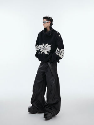 Back view of deconstructed vintage patchwork sweater showing full oversized silhouette and street-ready style