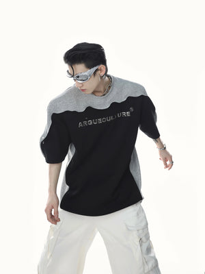 Edgy patchwork tee featuring bold 3D metallic print and unique wave sleeve design for streetwear fashion