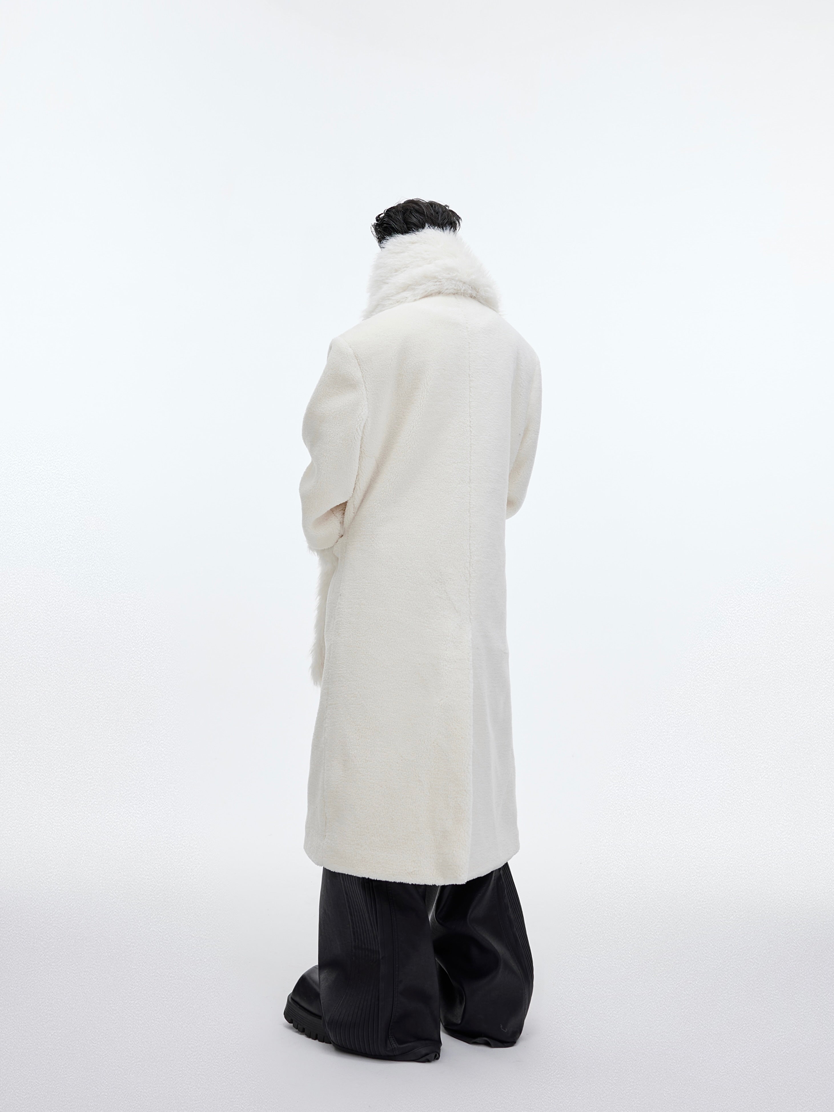 Front view of deconstructed patchwork tweed coat with unique button closure and oversized collar design