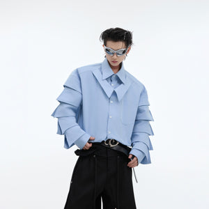 Close-up detail of the avant-garde pleated collar on this deconstructed streetwear top