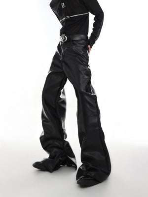 Front view of deconstructed pleated leather pants with split hem and slim fit design, perfect for streetwear fashion