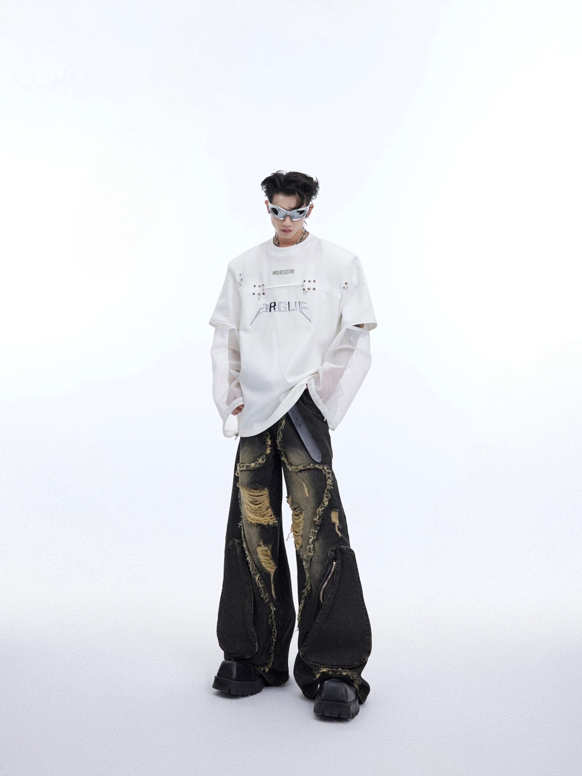 Back view of the deconstructed mesh sleeve tee highlighting its unconventional streetwear silhouette