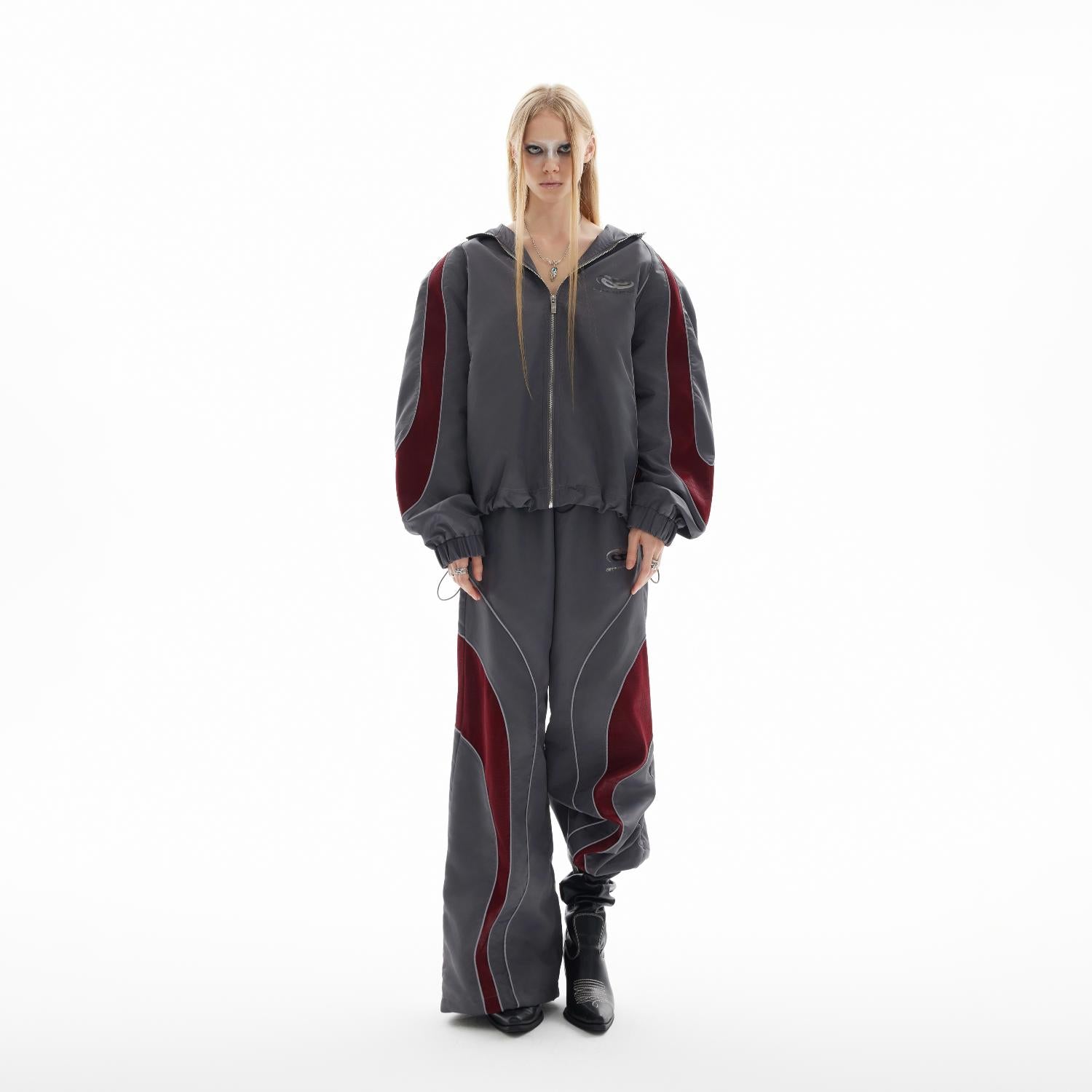 Close-up of PU material and avant-garde irregular cuts on this contemporary streetwear hoodie set