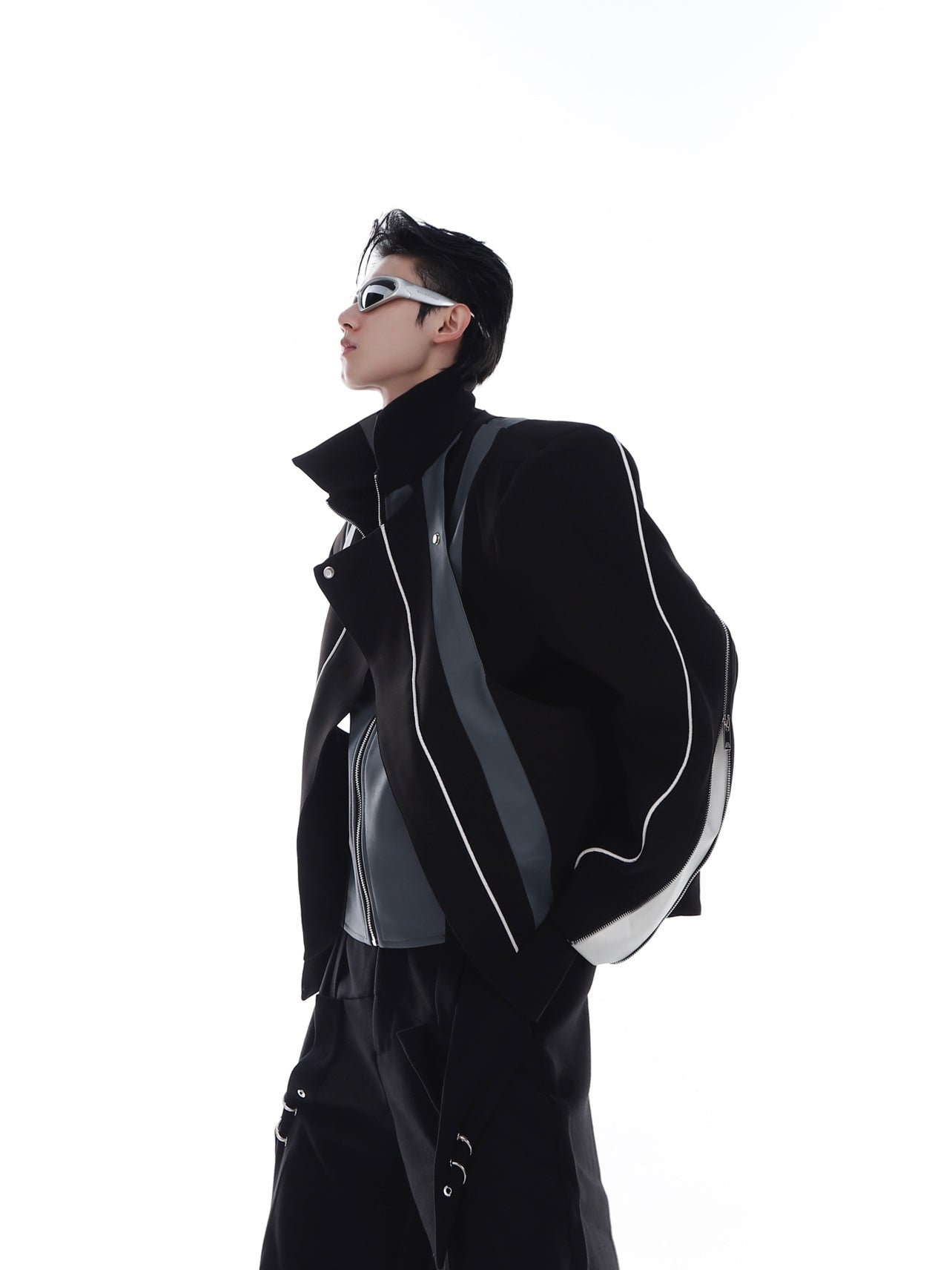Deconstructed PU leather biker jacket featuring bold shoulder pads, showcasing avant-garde streetwear design
