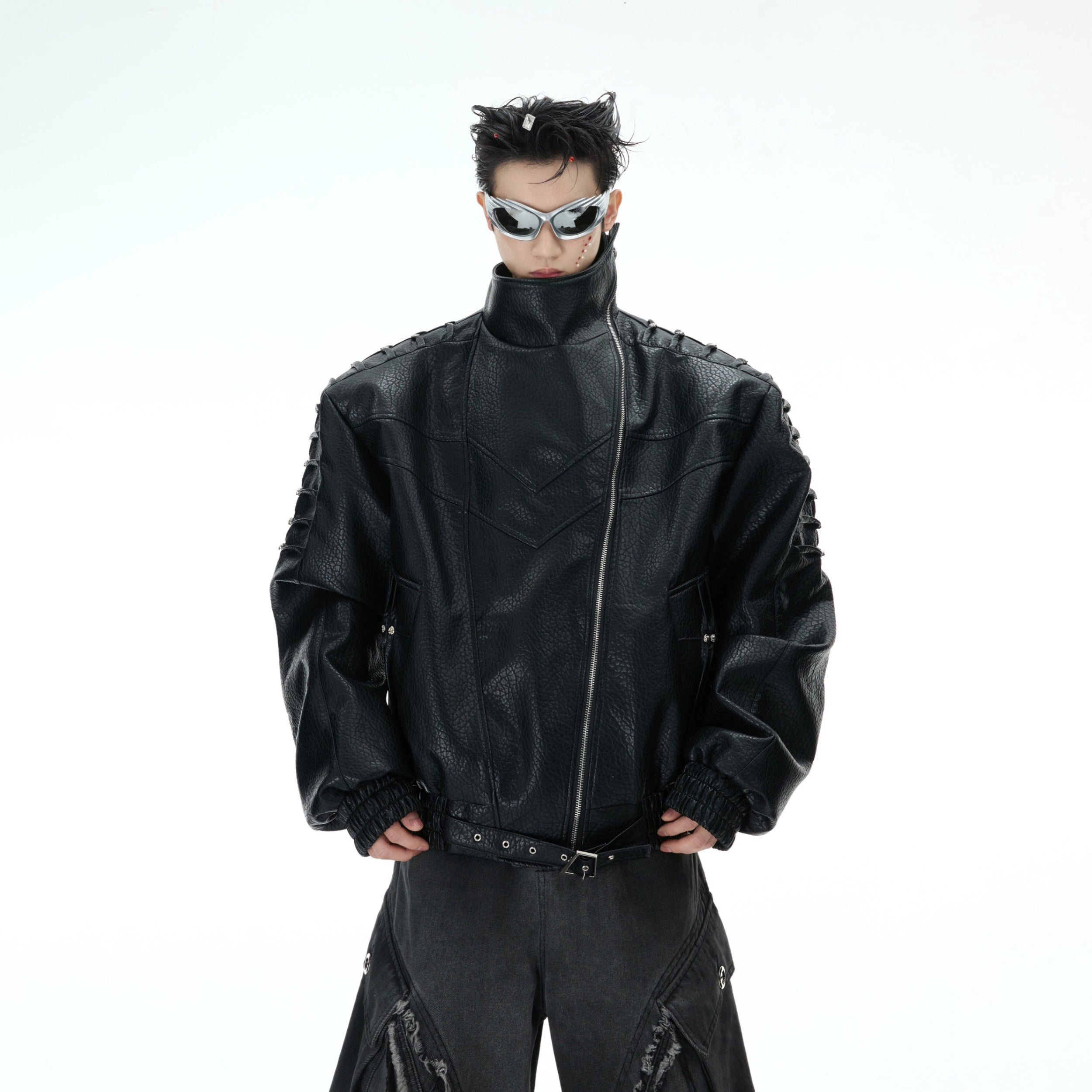 Detail shot showing adjustable hem on stylish streetwear leather jacket with stud accents
