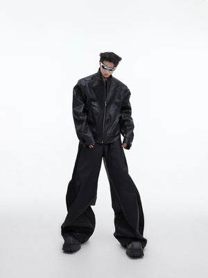 Back view of stylish cropped jacket featuring bold 3D metal triangle detailing on PU leather