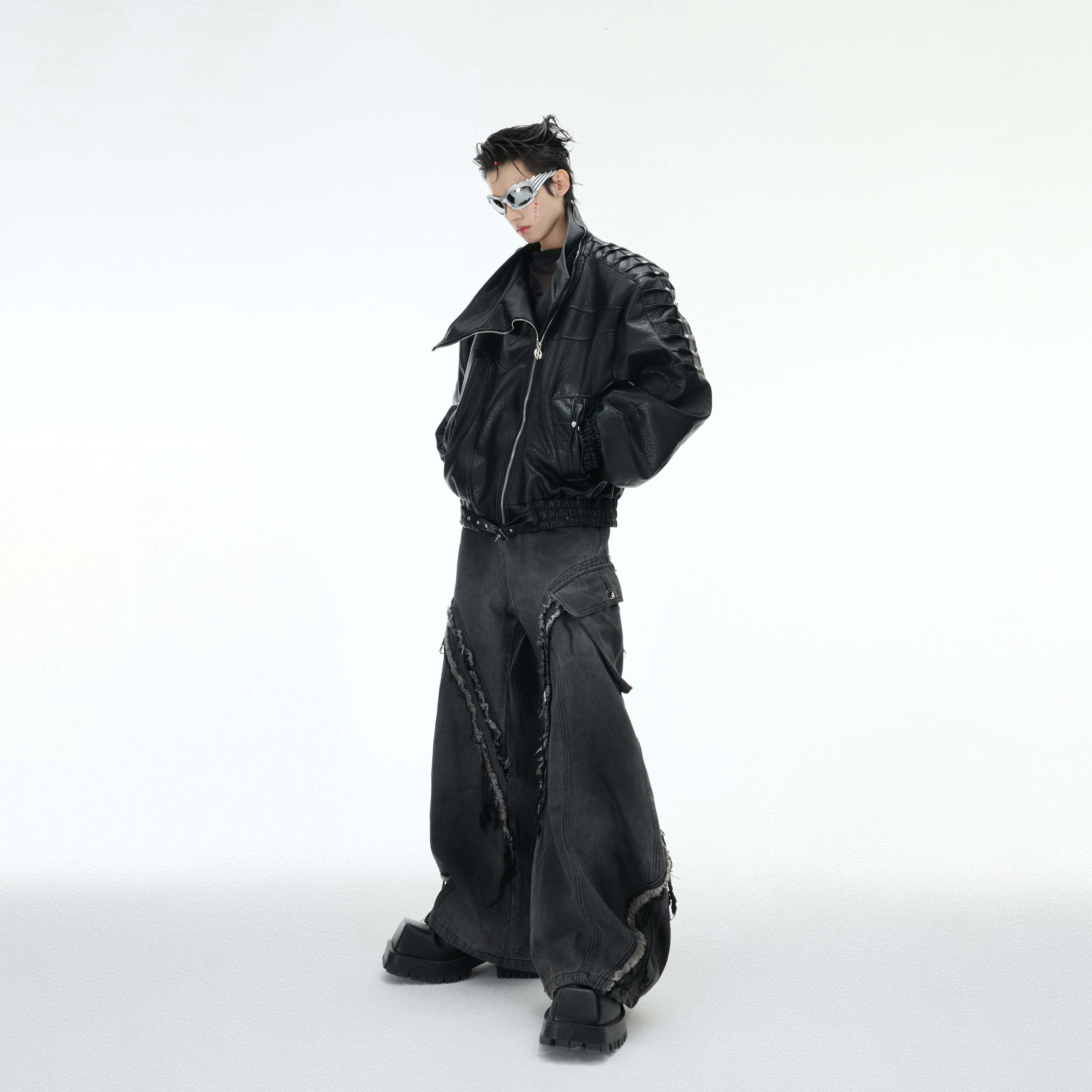 Close-up of crushed metal stud detailing on high-quality PU leather streetwear jacket