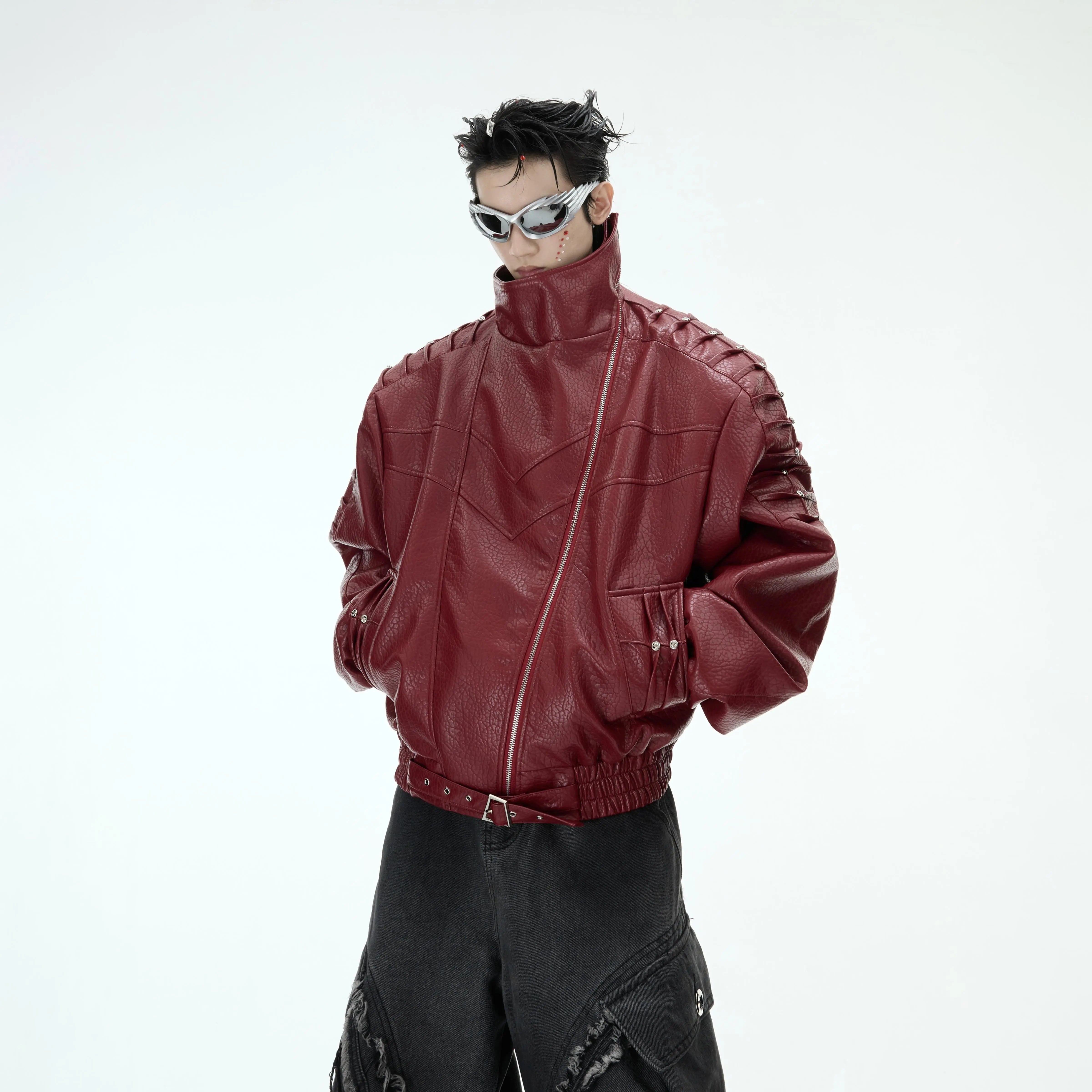Front view of edgy streetwear PU leather jacket with crushed metal studs and adjustable hem