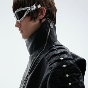 Close-up of unique spine-wrinkle design on back of punk-inspired leather jacket with metal studs