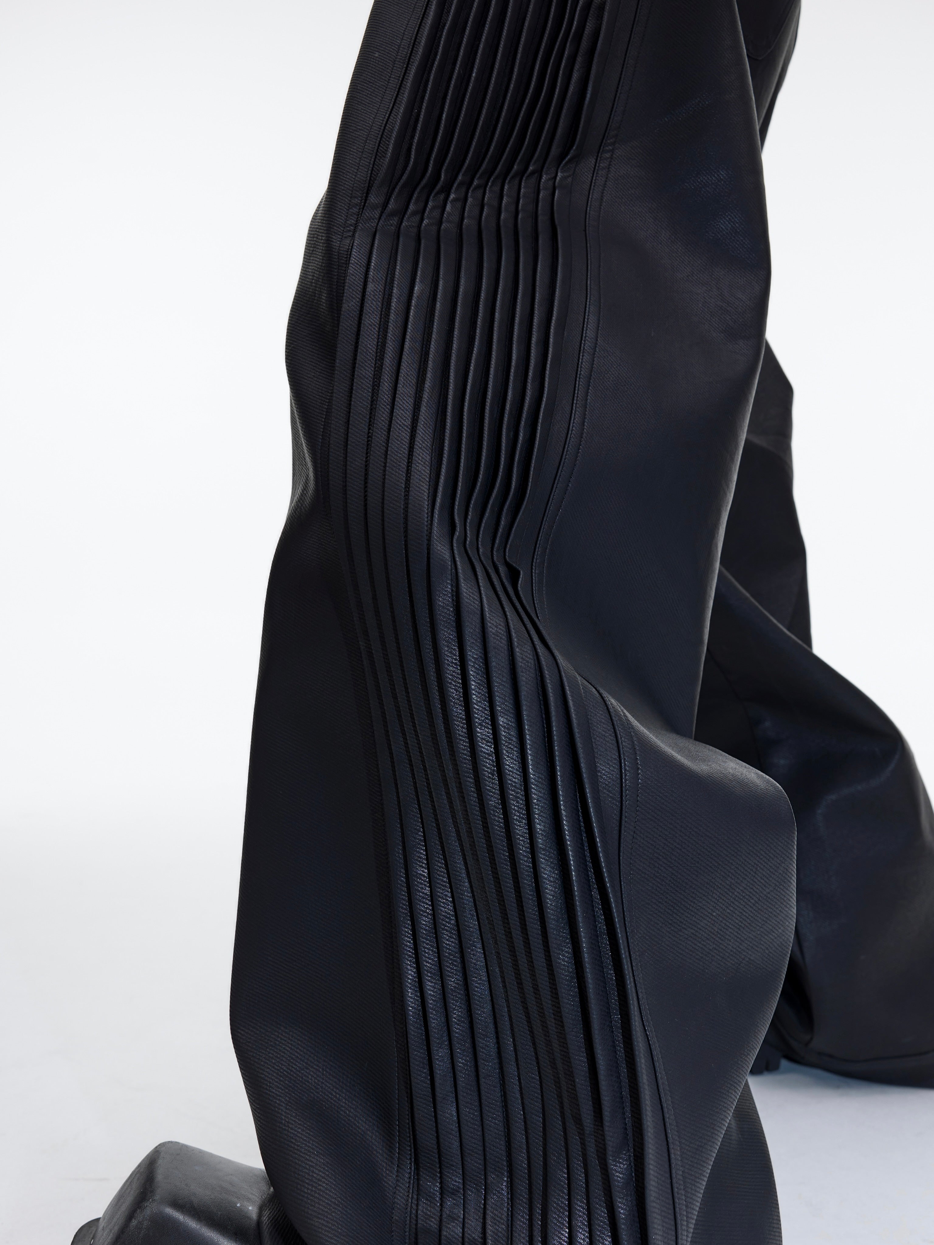 Close-up of the premium matte leather texture on these high-fashion trousers