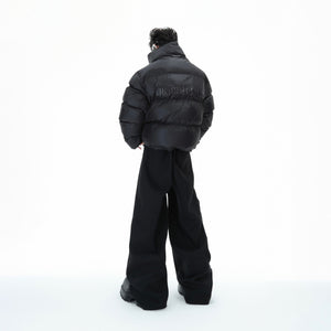 Back view of urban streetwear puffer jacket featuring high neck design and oversized silhouette