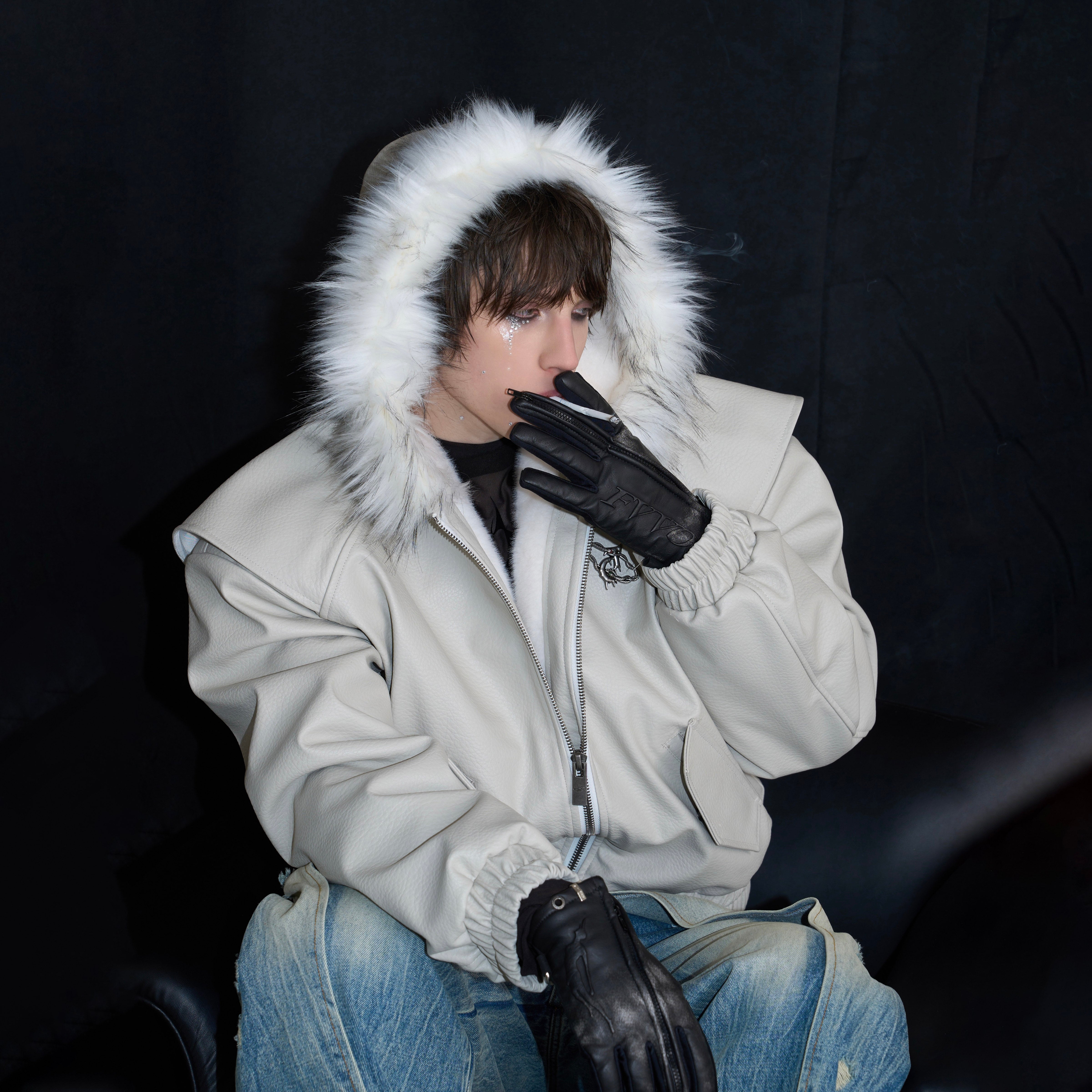 Reversible puffer jacket shown in black and silver color options with weatherproof fabric and adjustable hood