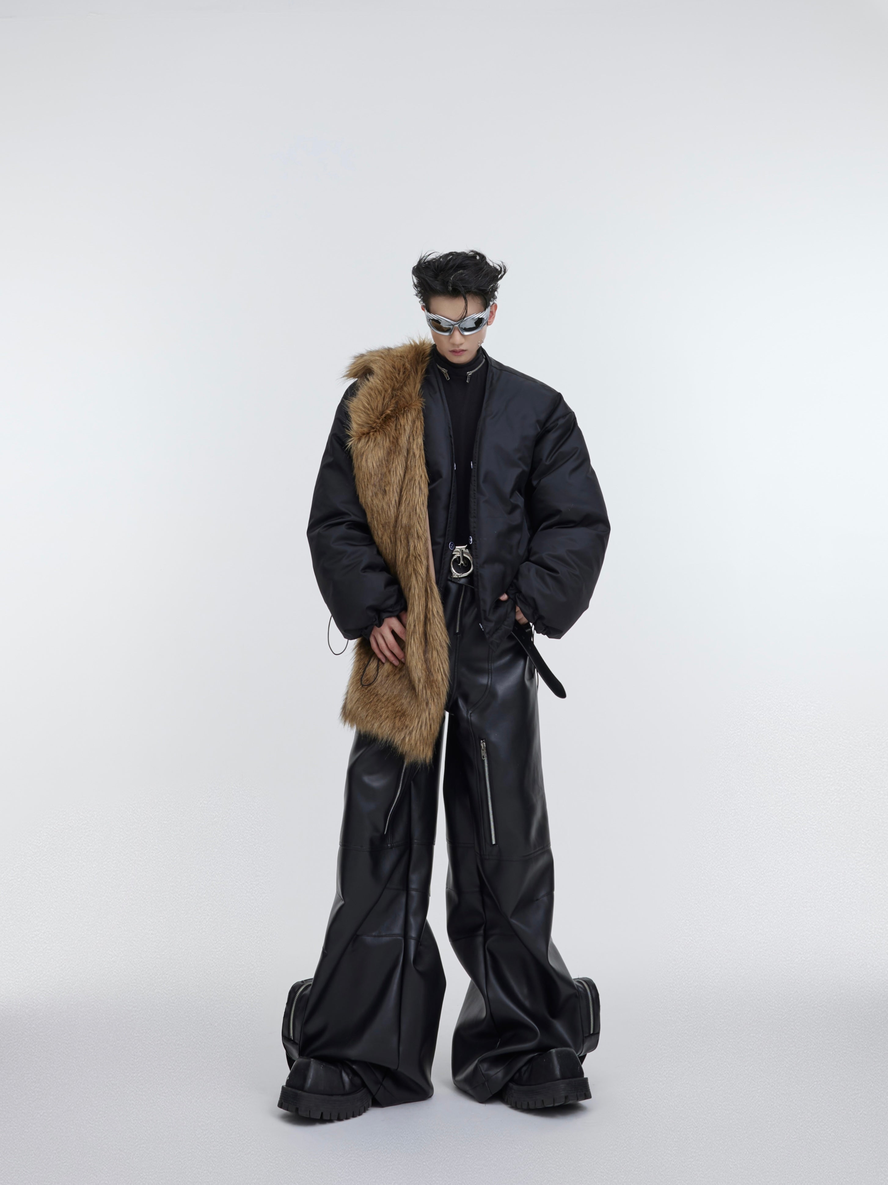 Model wearing zipped-up oversized puffer coat with statement streetwear aesthetic