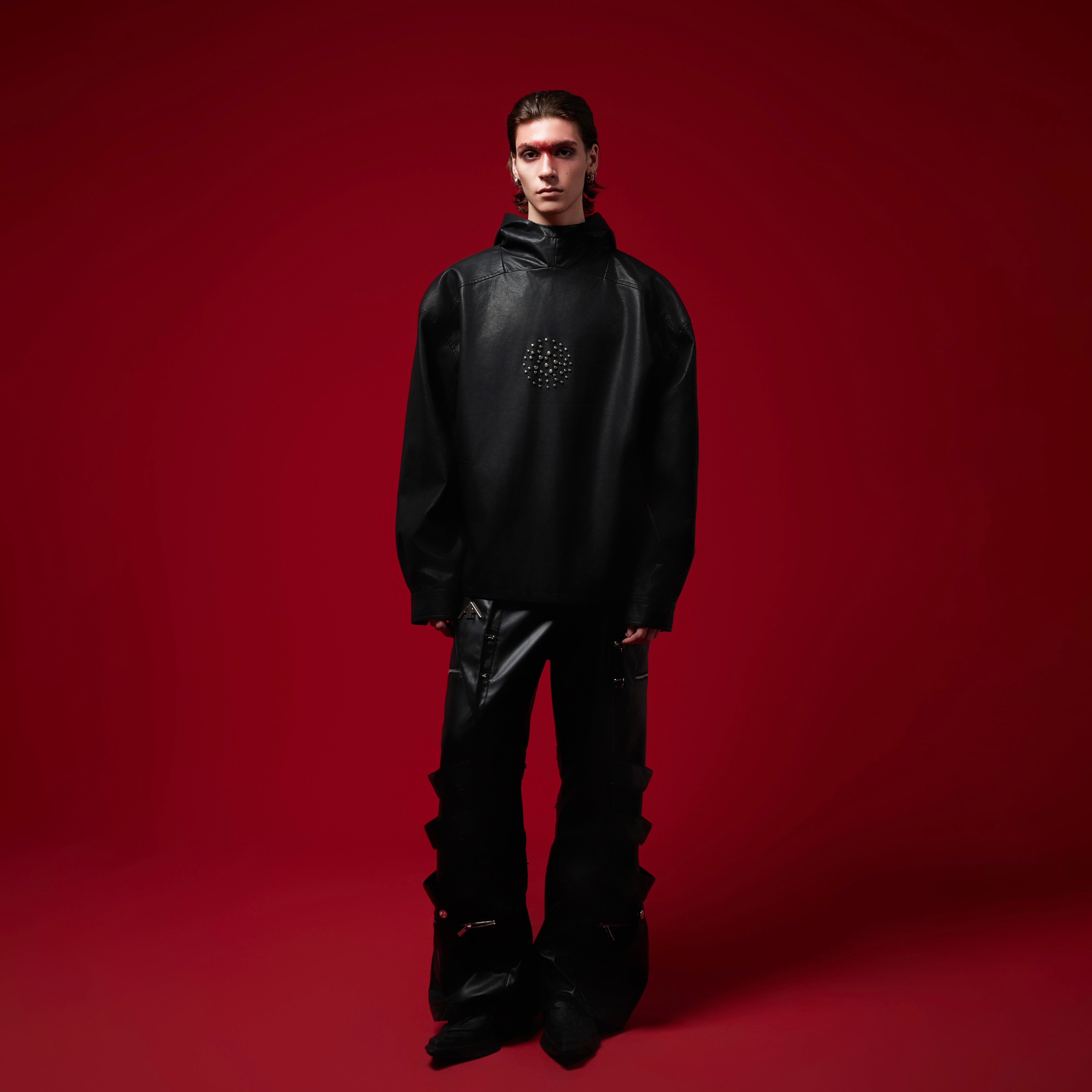 Side view of oversized PU leather hoodie showcasing unique ink-wash pattern and dropped shoulders