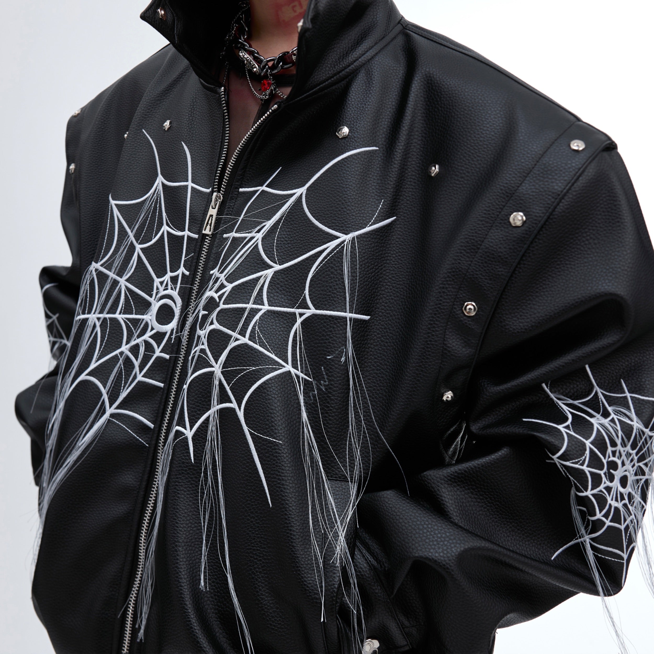 Stylish model wearing the deconstructed spiderweb fringe leather jacket with street-ready attitude