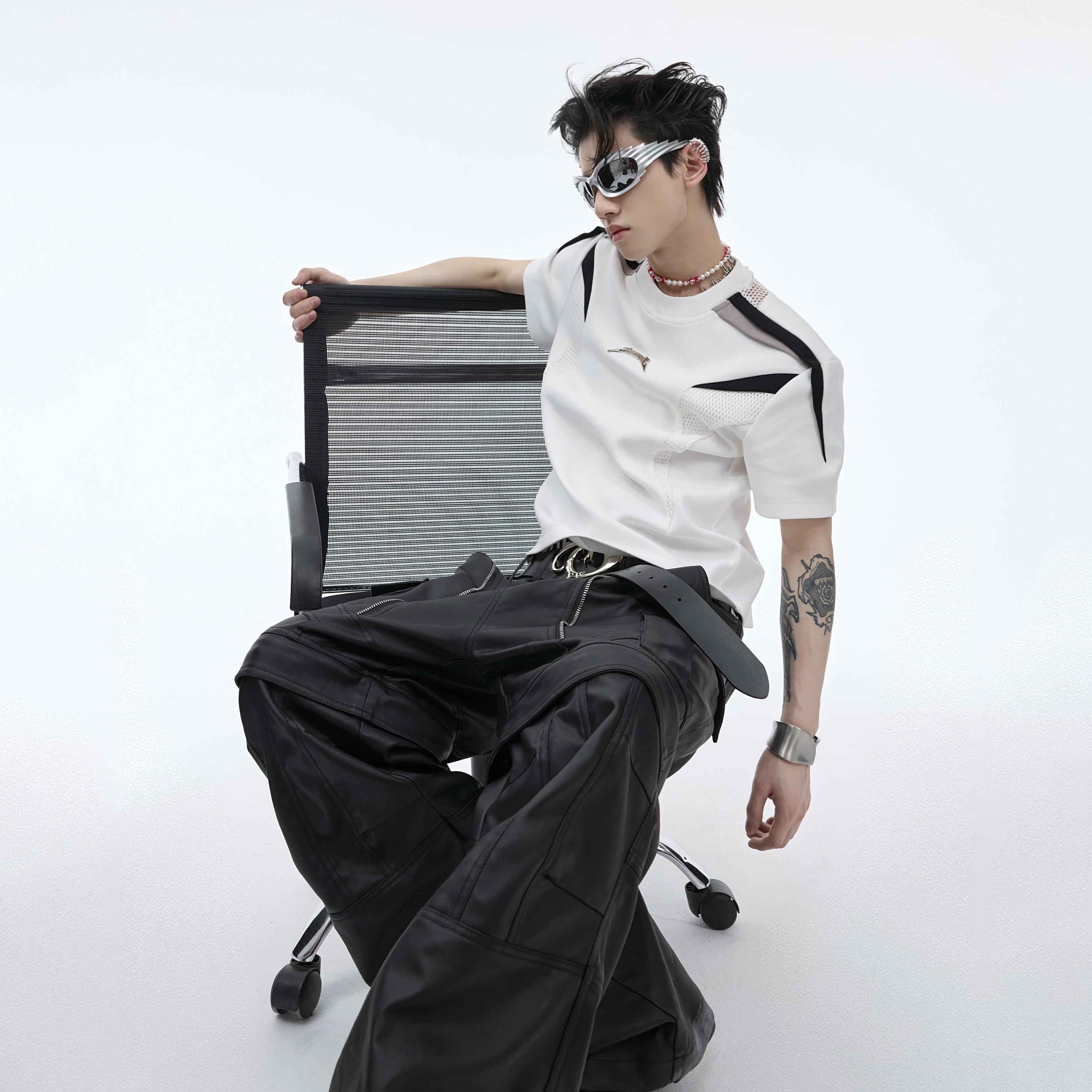 Unique raw-edge sleeveless t-shirt showcasing bold unisex fashion statement
