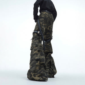 Close-up of belt loops and rugged details on these vintage-style camouflage work pants for streetwear fashion