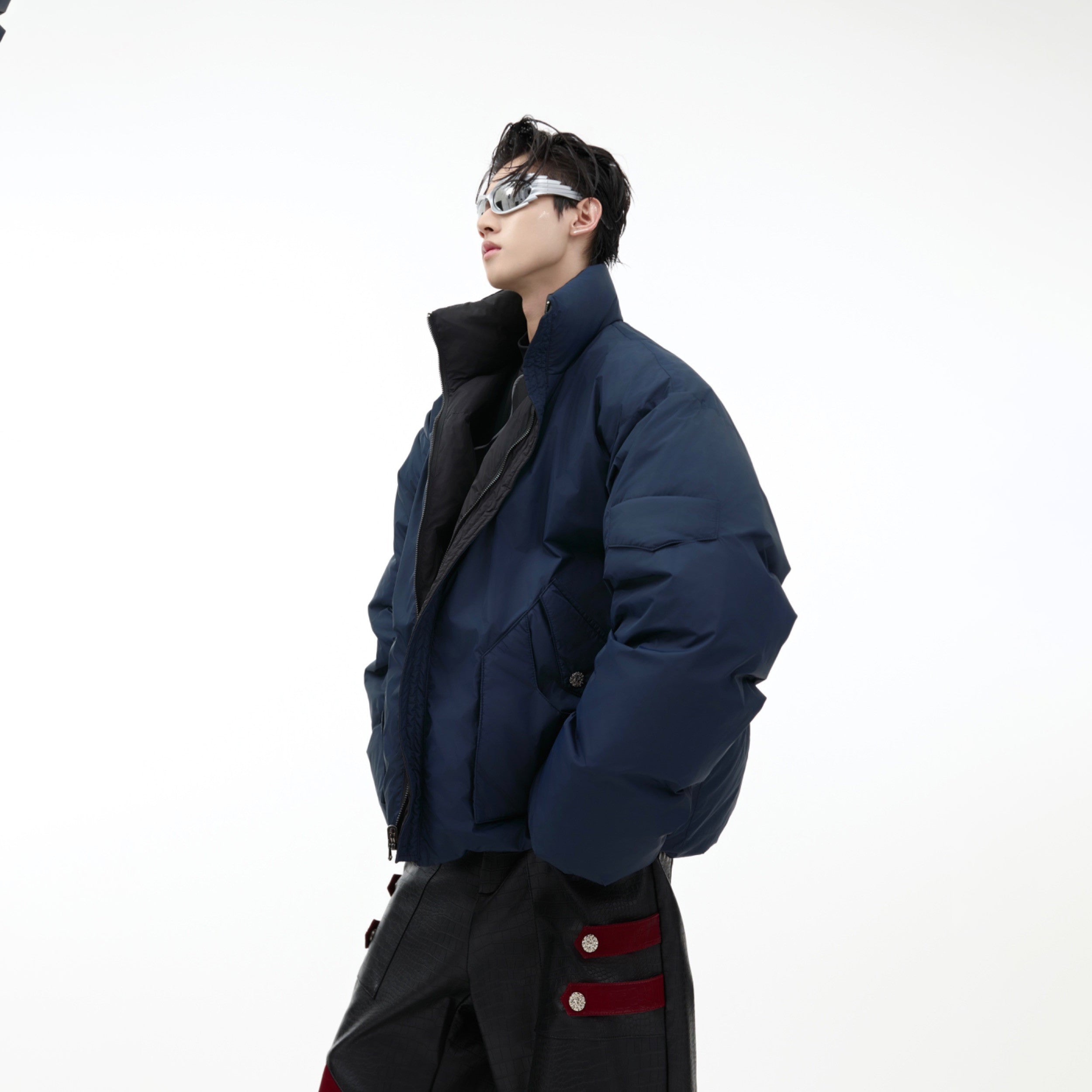 White retro puffer jacket with reversible stand collar, showcasing the winter streetwear style with duck down filling