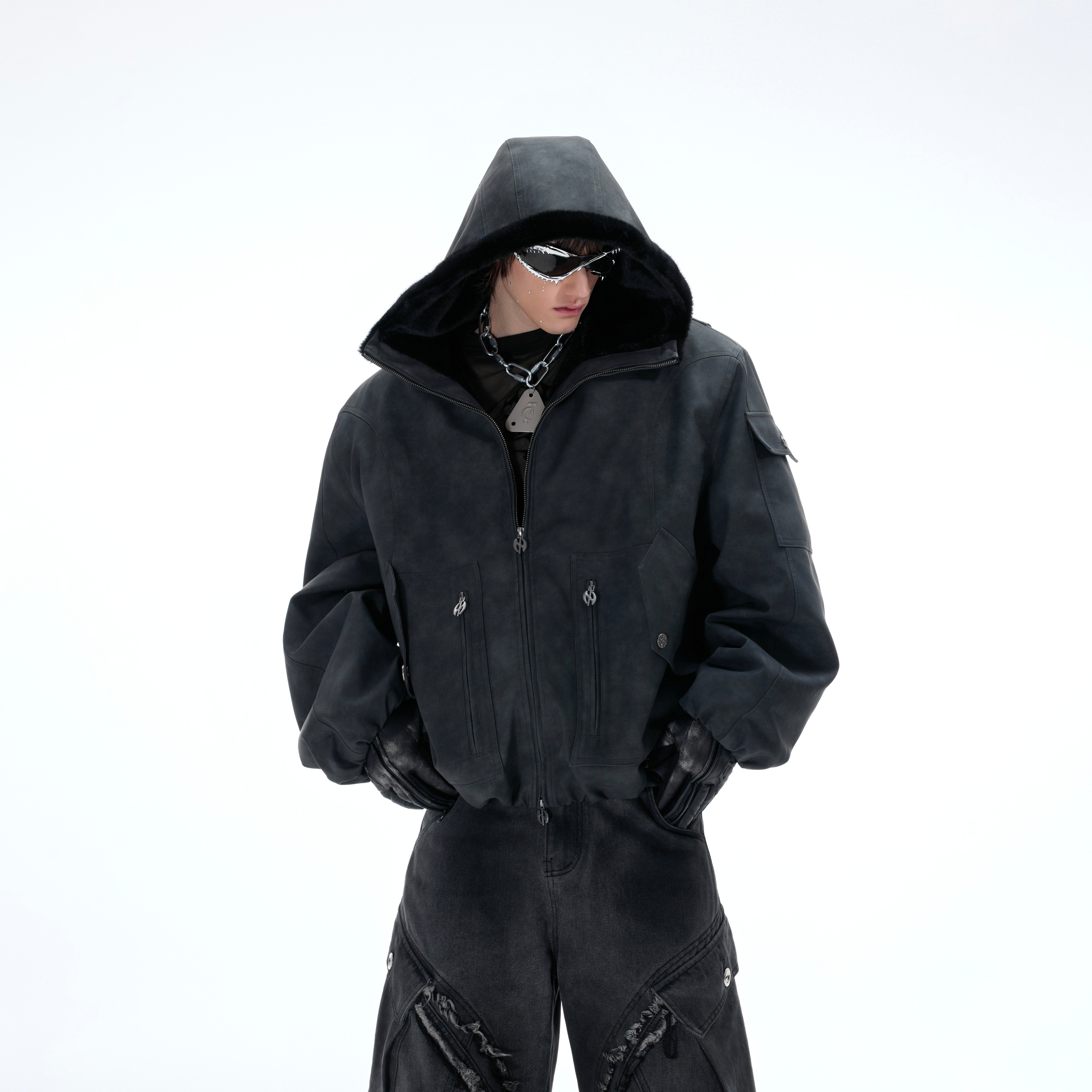 Distressed reversible puffer jacket featuring hood and oversized streetwear design with premium PU leather side