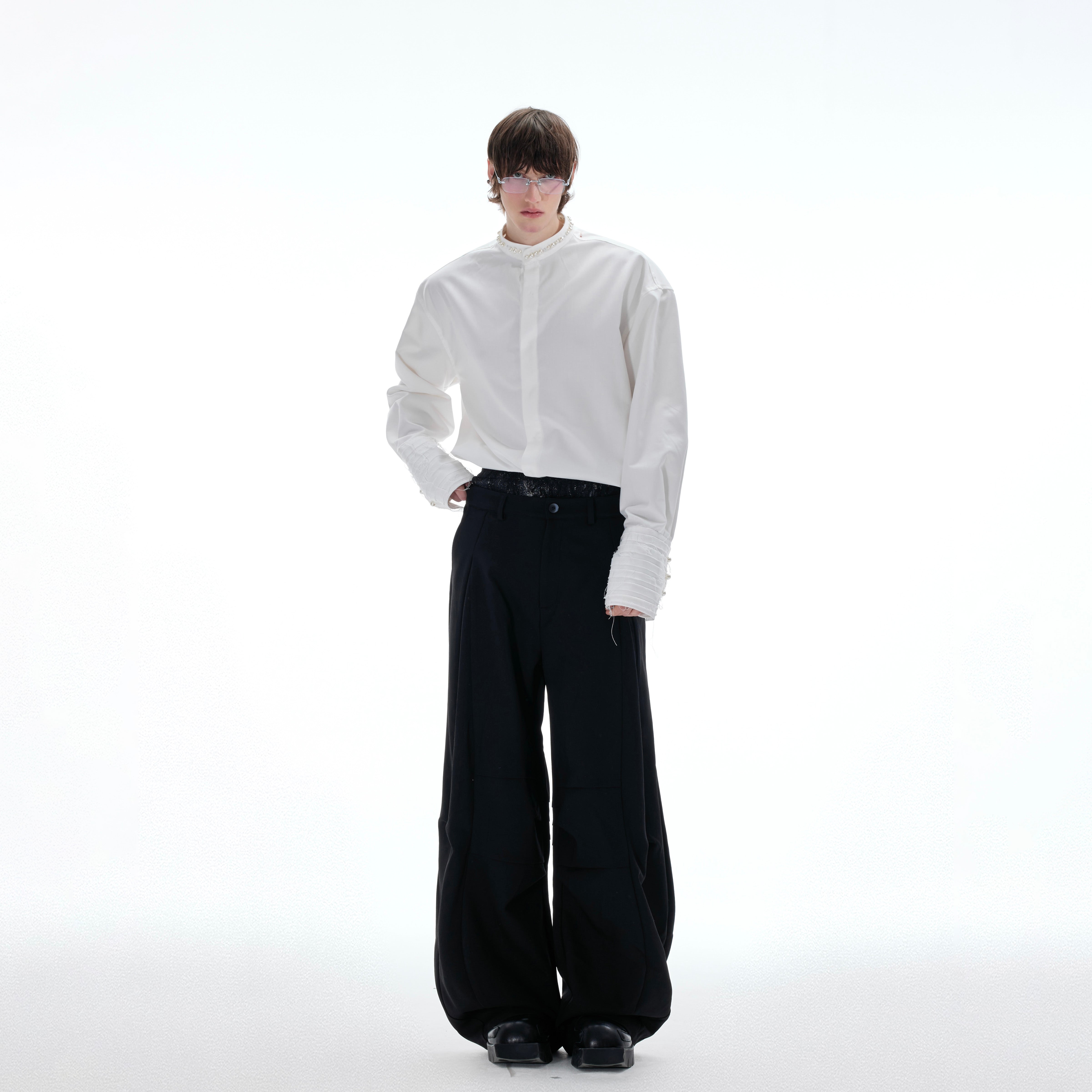 Back view of luxury pearl-embellished blouse featuring breathable fabric and sophisticated design