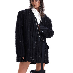 Close-up of the intricate sequin and fringe texture on this premium streetwear jacket with urban edge