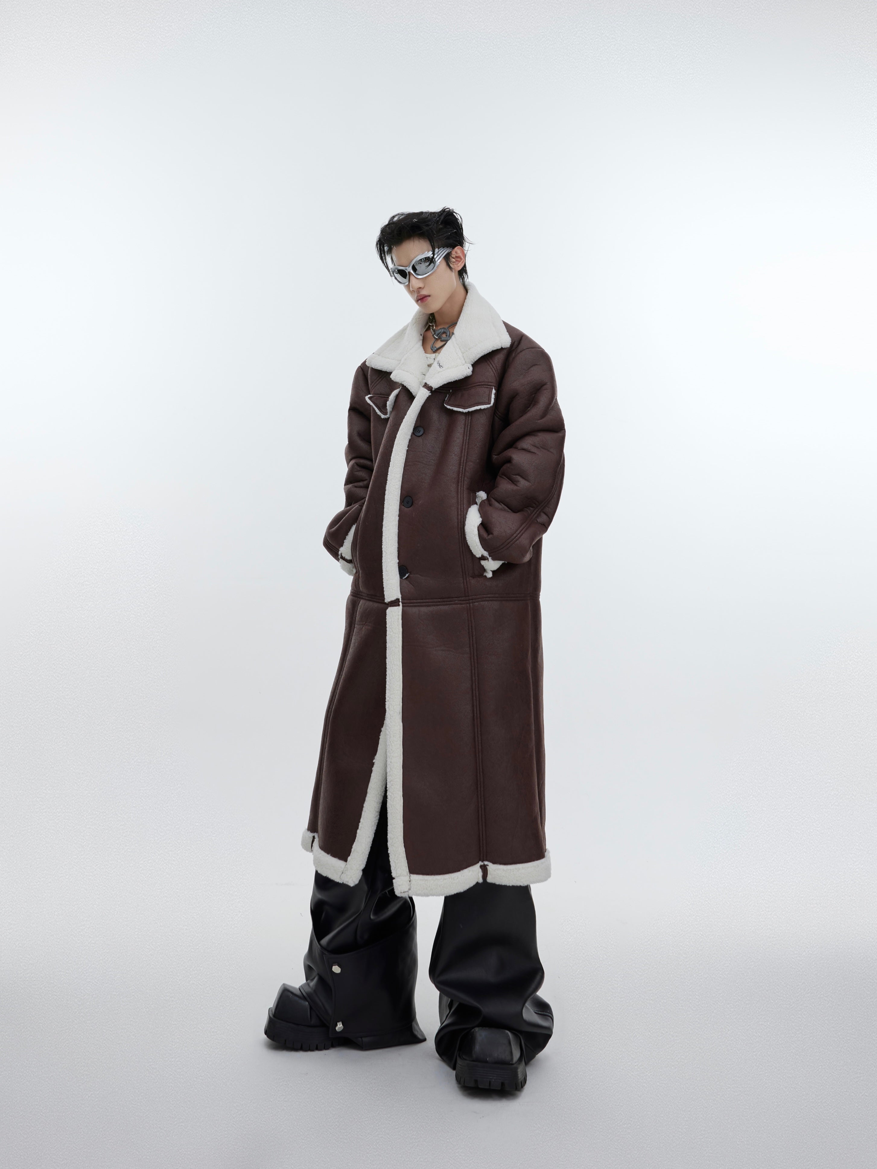 Close-up of the back design on this avant-garde long coat showing unique deconstructed elements