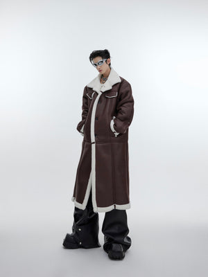 Close-up of the back design on this avant-garde long coat showing unique deconstructed elements