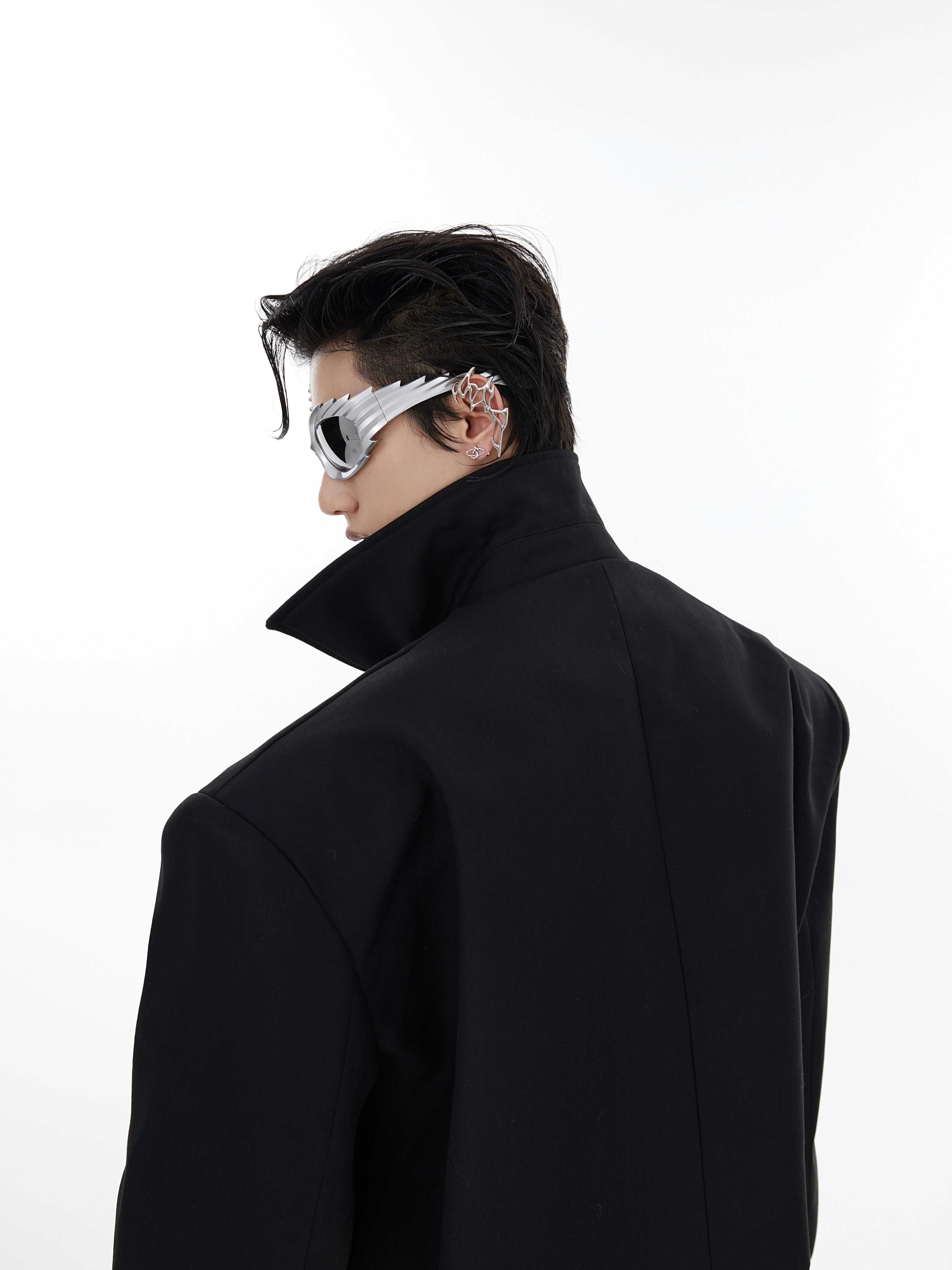 Back perspective of the cropped blazer highlighting quality workwear stitching and tailored fit