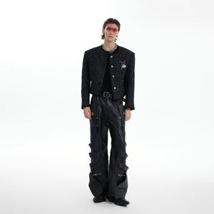 Front view of cropped deconstructed coat with dimensional detailing and modern silhouette