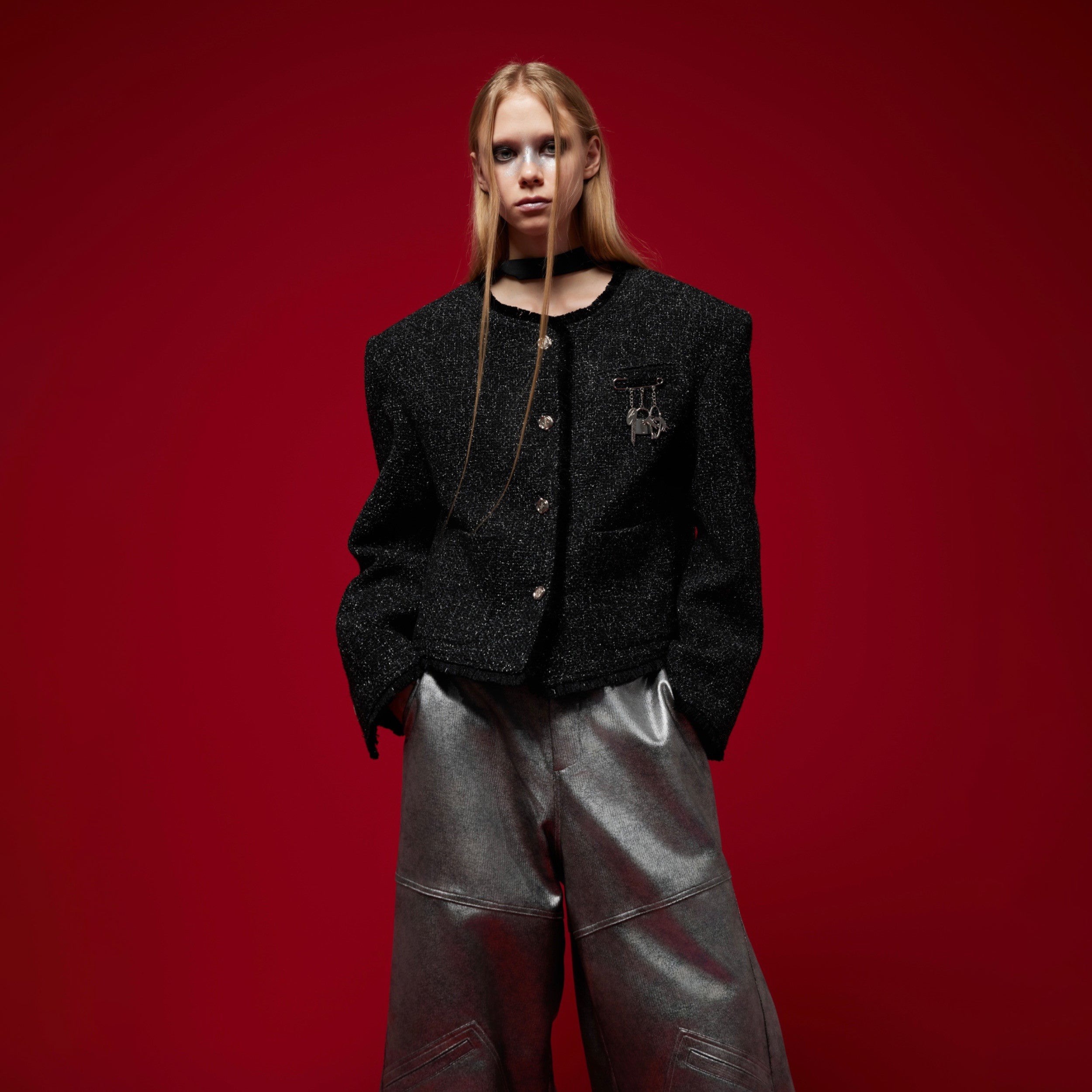 Back view of fashion-forward short jacket highlighting textured dimensional construction