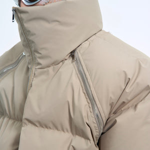 Back view of the heavyweight short puffer coat showing its deconstructed streetwear aesthetic