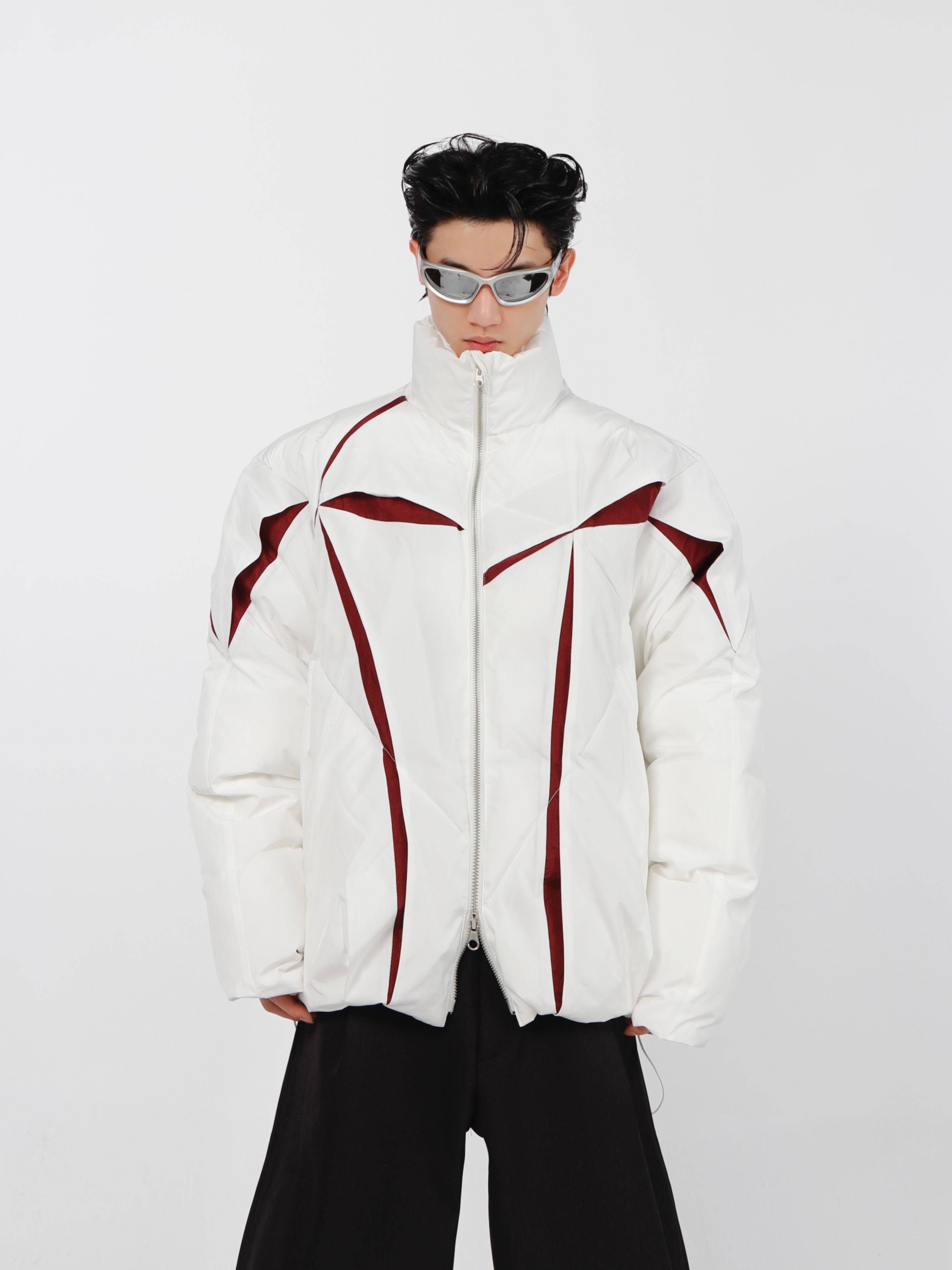 Split-color deconstructed puffer jacket with stand collar, showcasing avant-garde streetwear design for urban fashion