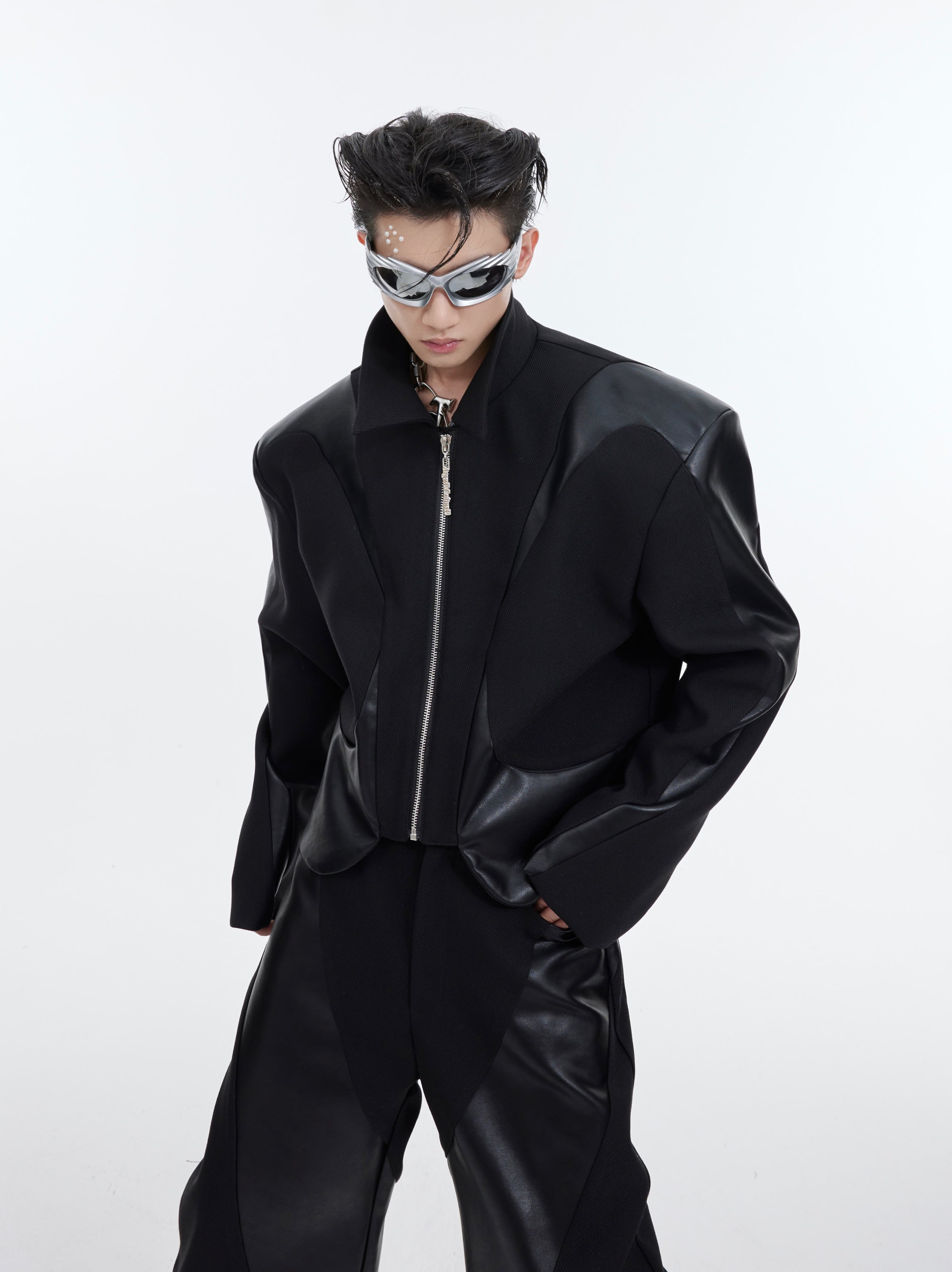 Full outfit styling of shoulder-pad suit demonstrating how to wear this bold fashion statement piece