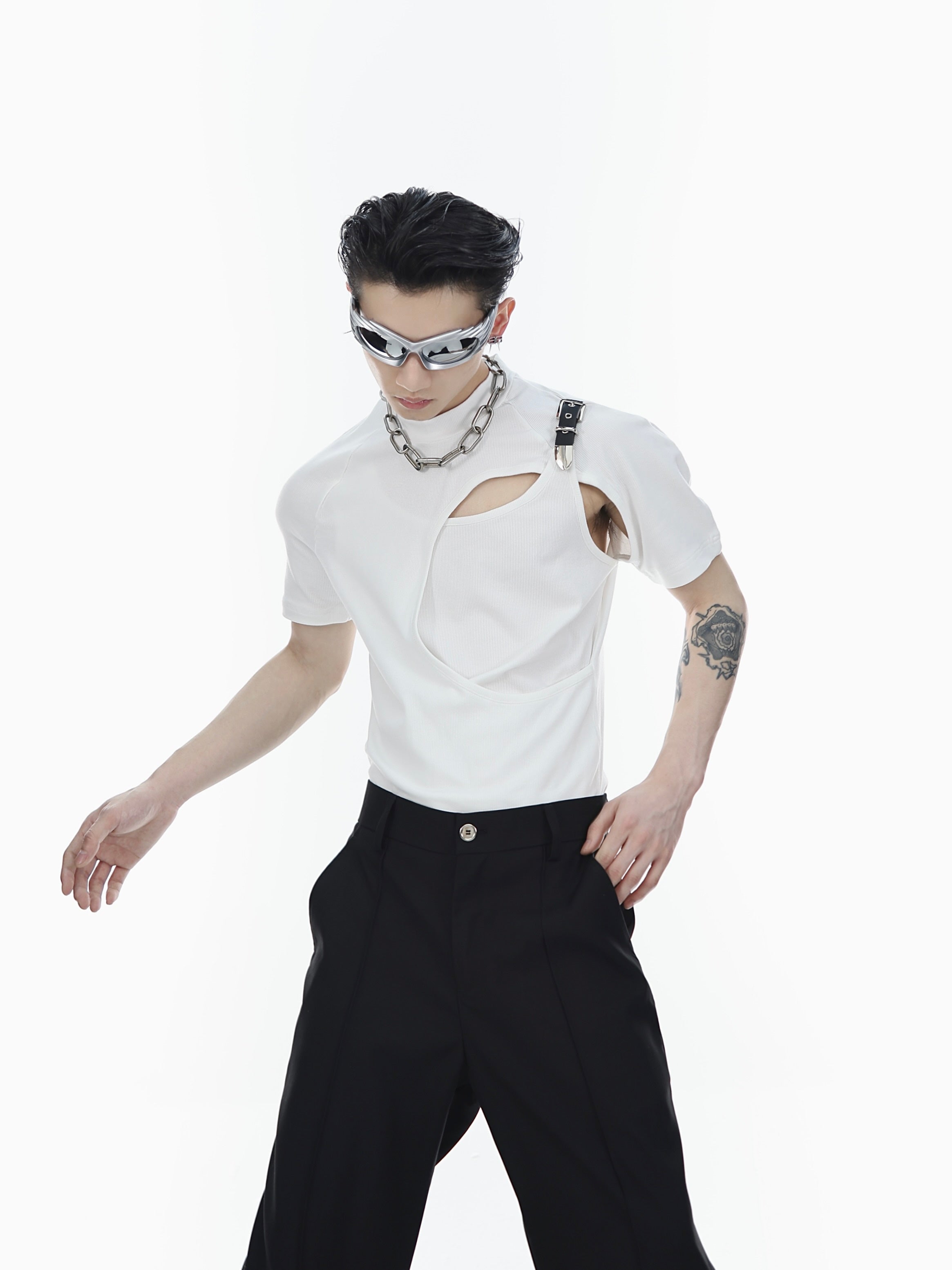 Slim-fit deconstructed black tee featuring bold cutout design and buckle accents for edgy streetwear style