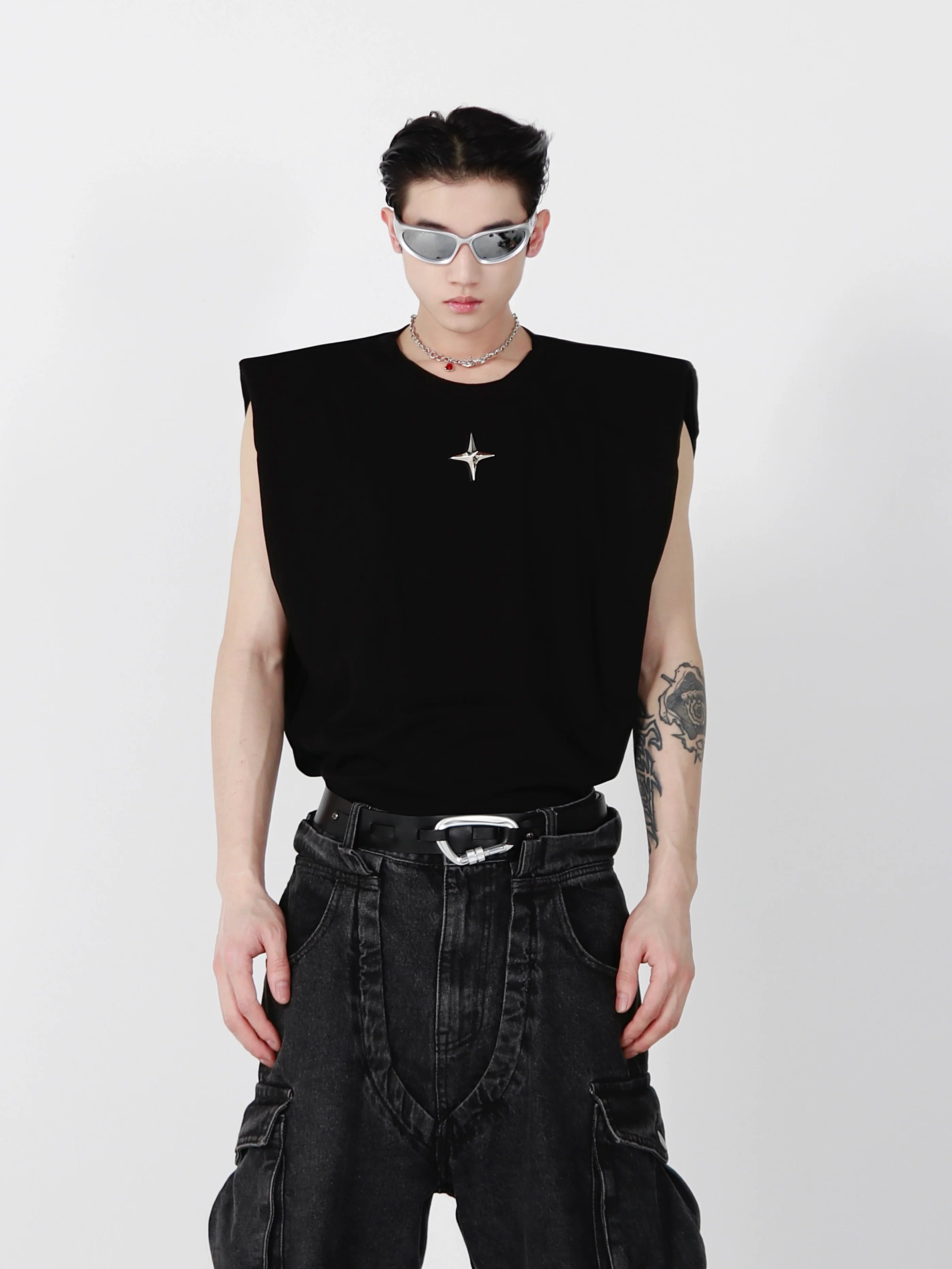 Slim-fit sleeveless tee with structured shoulder pads and metallic trim details for urban streetwear looks
