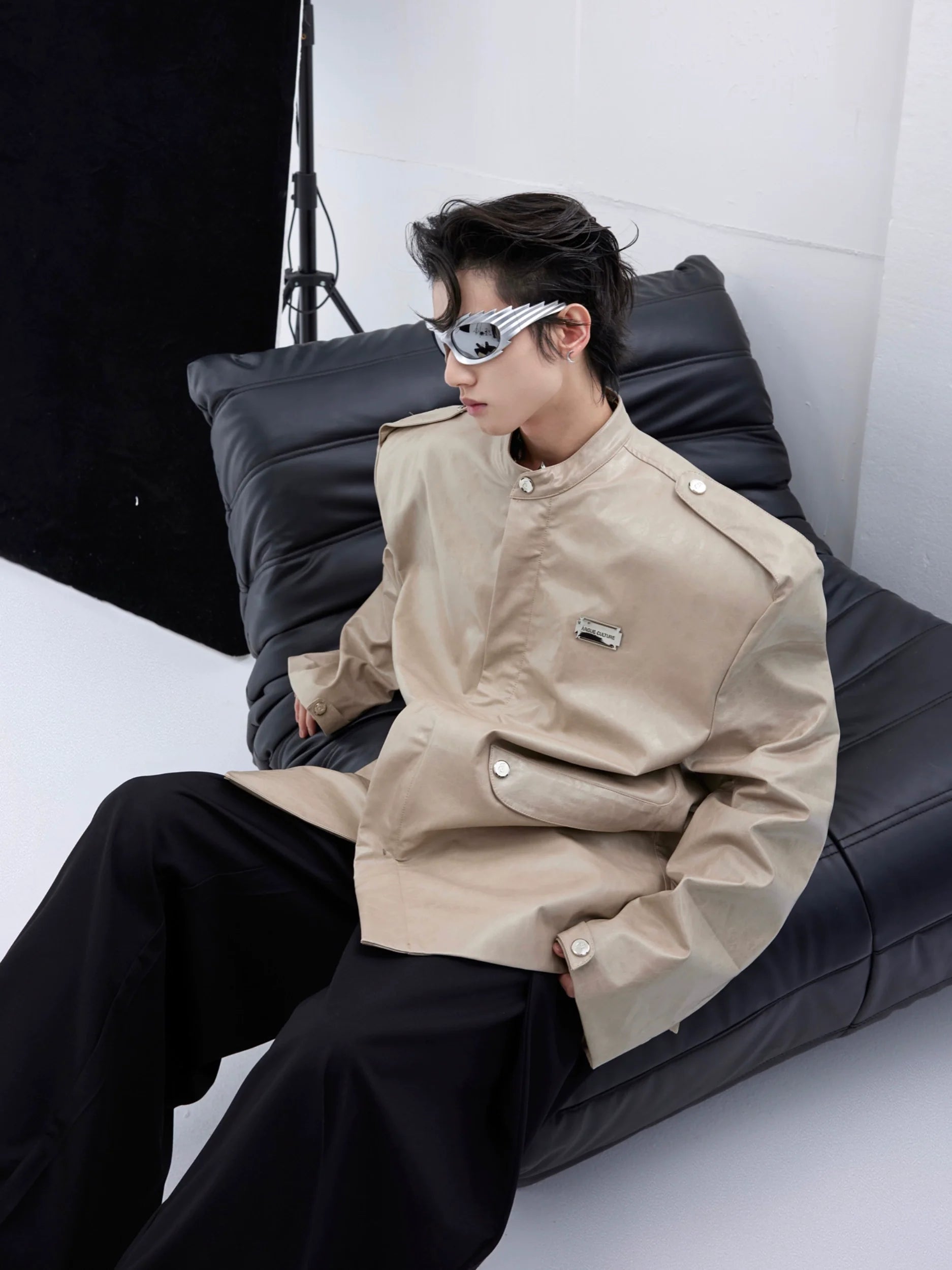 Front view of slim fit textured PU leather blazer jacket with shoulder pads, showing contemporary streetwear design