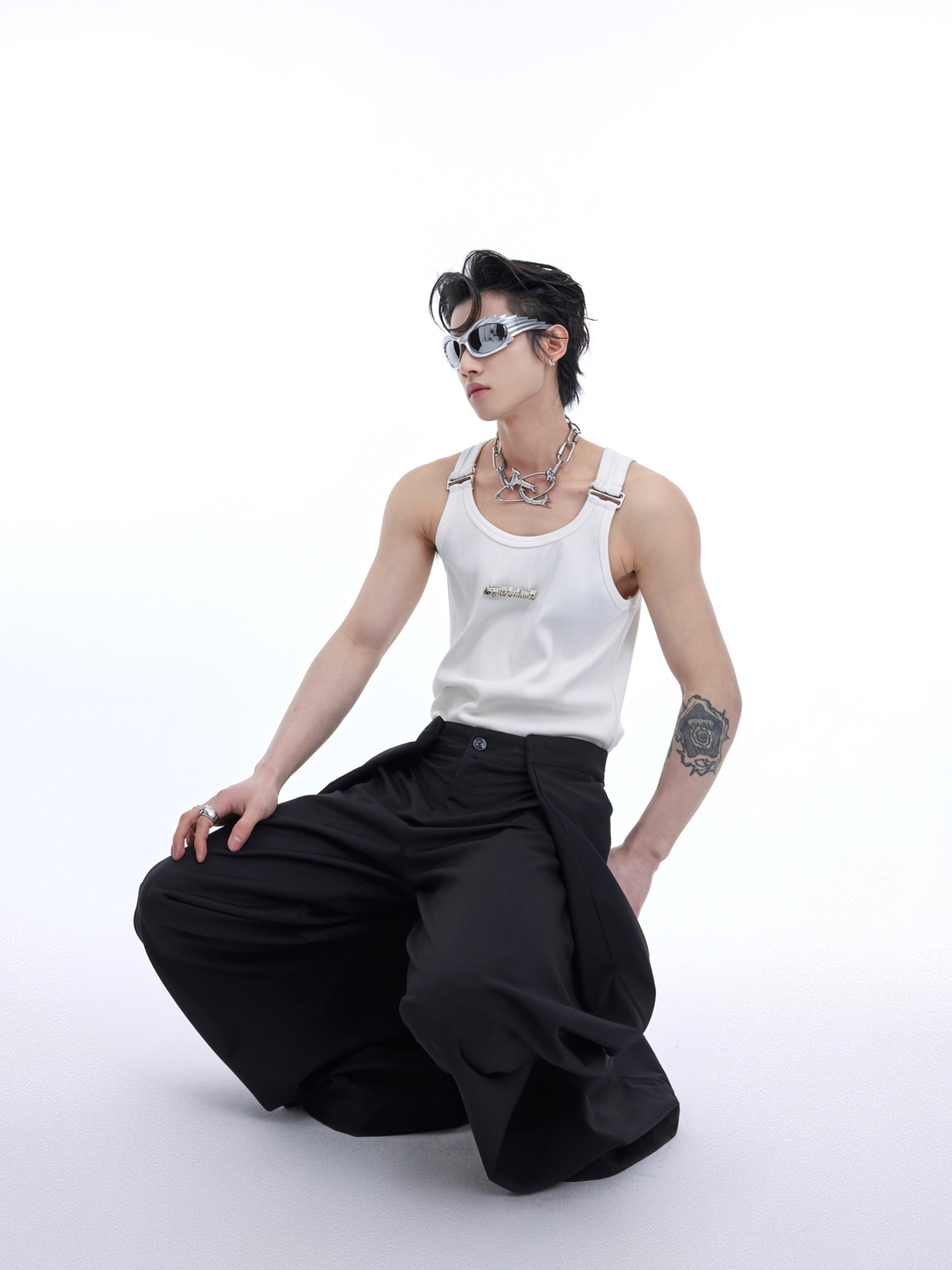 Front view of solid color genderless vest with slim fit silhouette for edgy street fashion