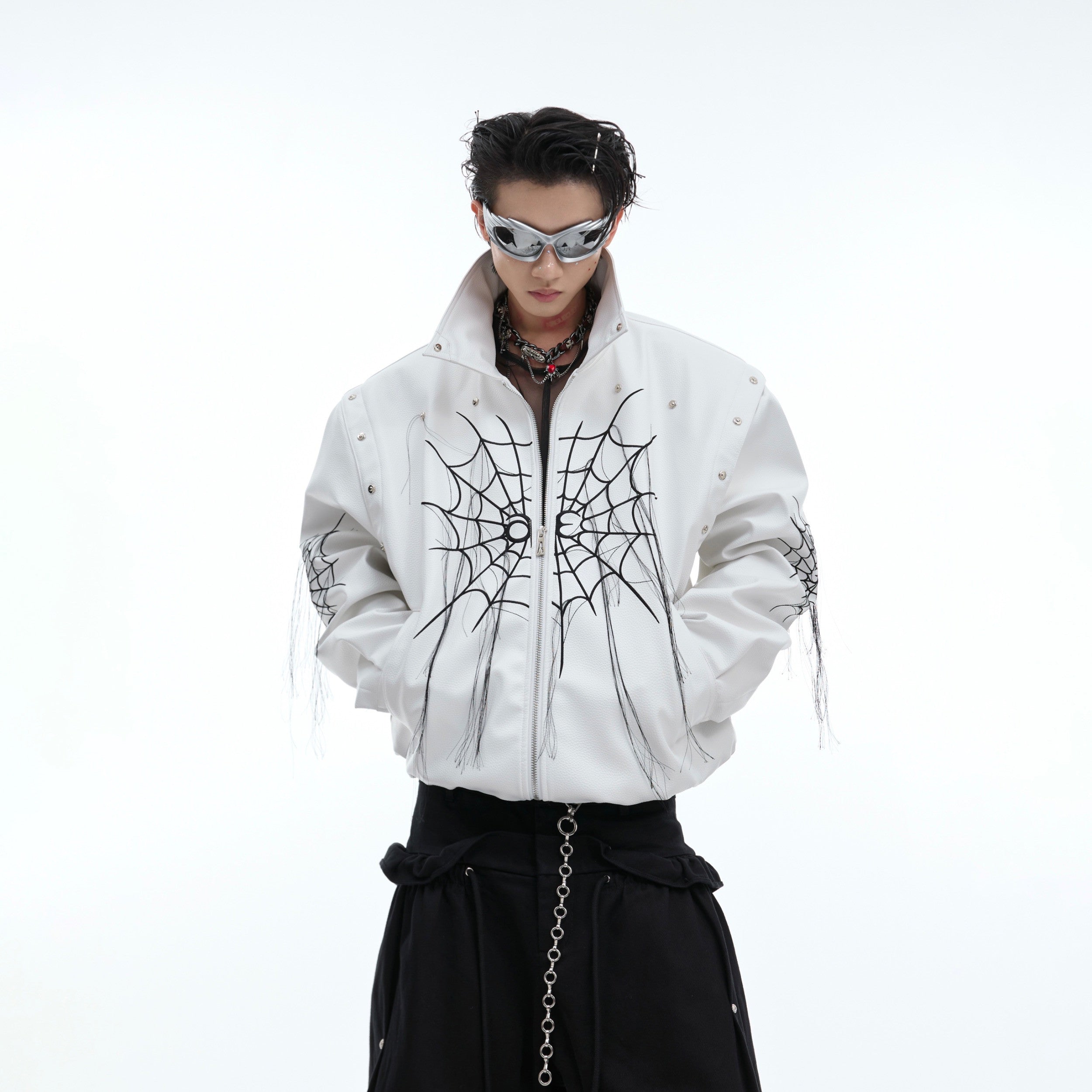 Edgy spiderweb fringe punk leather jacket with metal studs, featuring a deconstructed biker design and premium craftsmanship