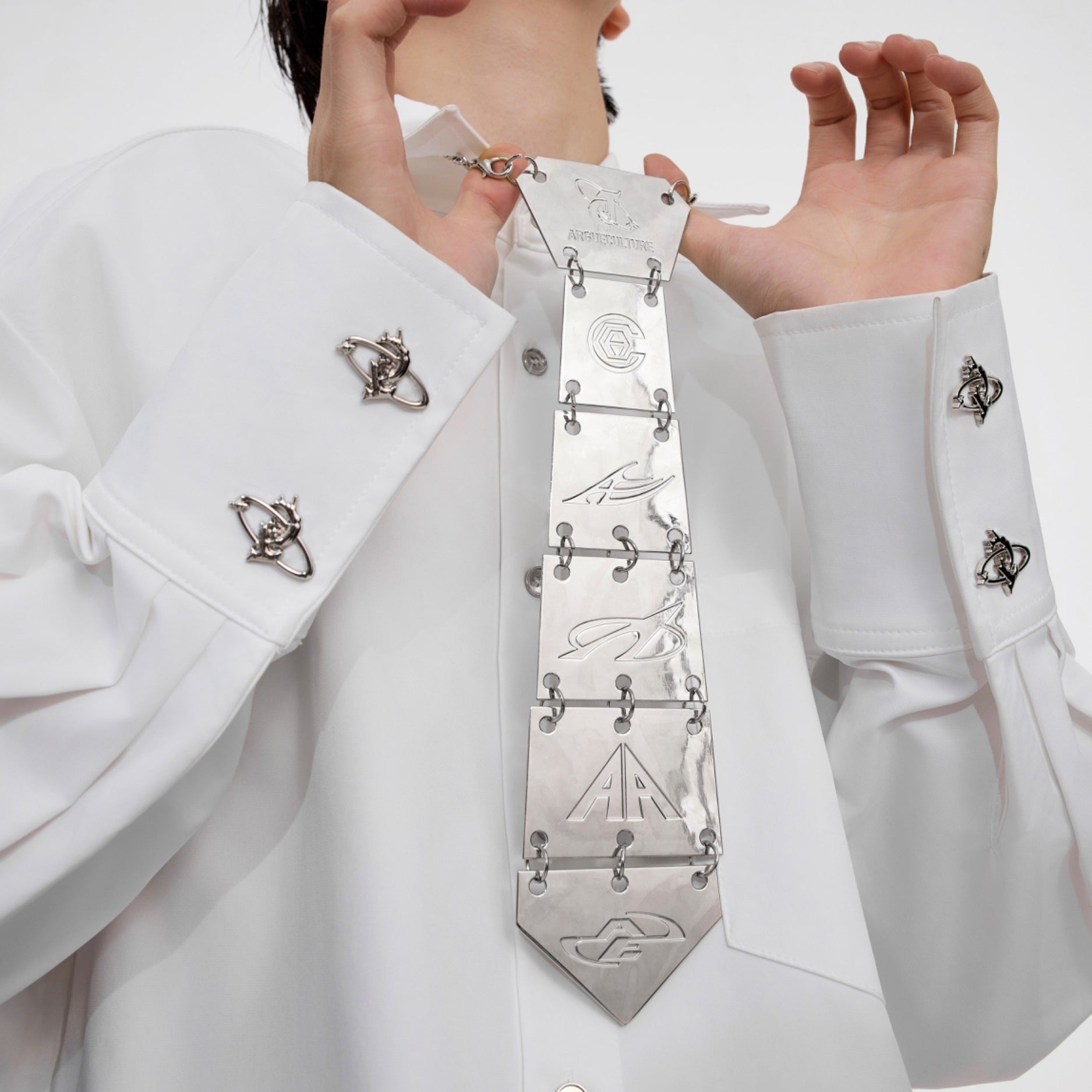 Top view of vertebrae-inspired tie necklace laid flat to show full length and unique skeletal design