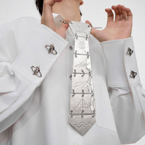 Top view of vertebrae-inspired tie necklace laid flat to show full length and unique skeletal design